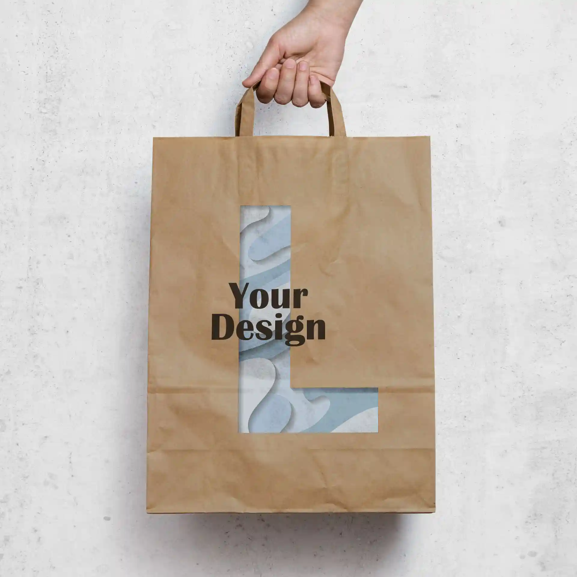 Brown paper carrier bag with a rectangular shape, featuring a cut-out design and text on the front.