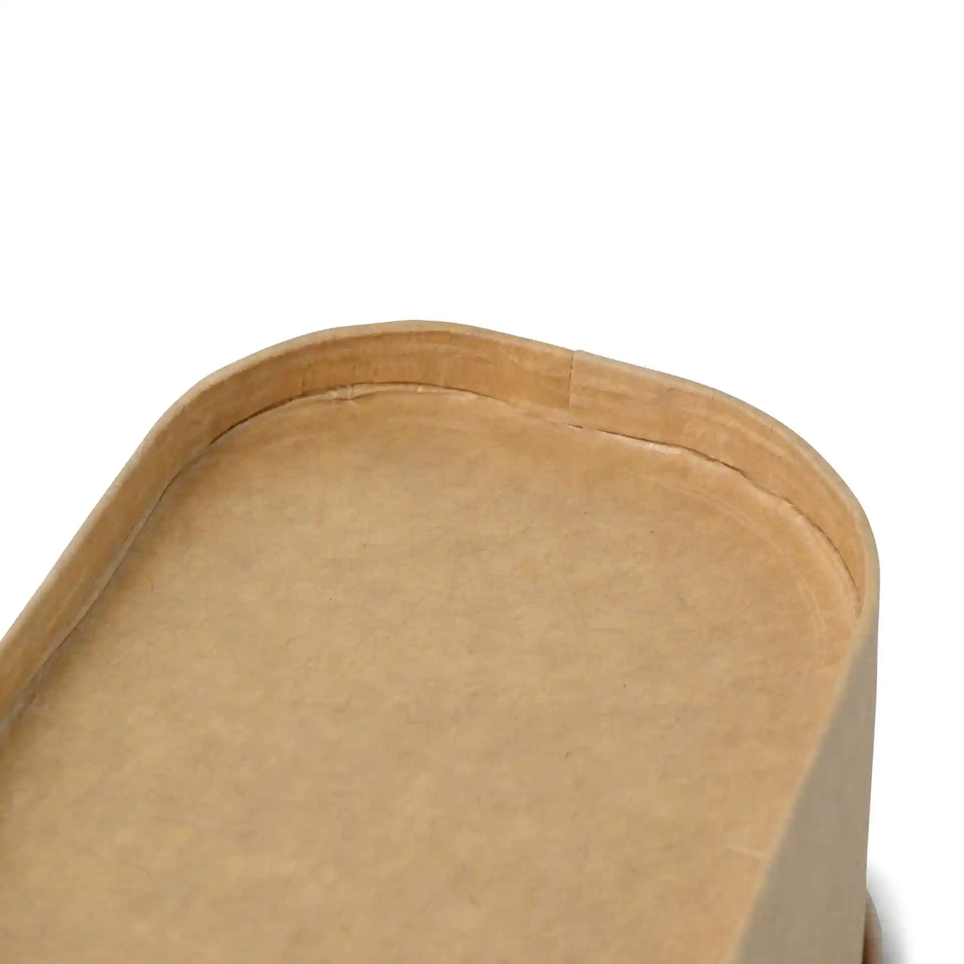 Close-up of a rectangular brown cardboard food container with rounded edges and a visible seam on the top.