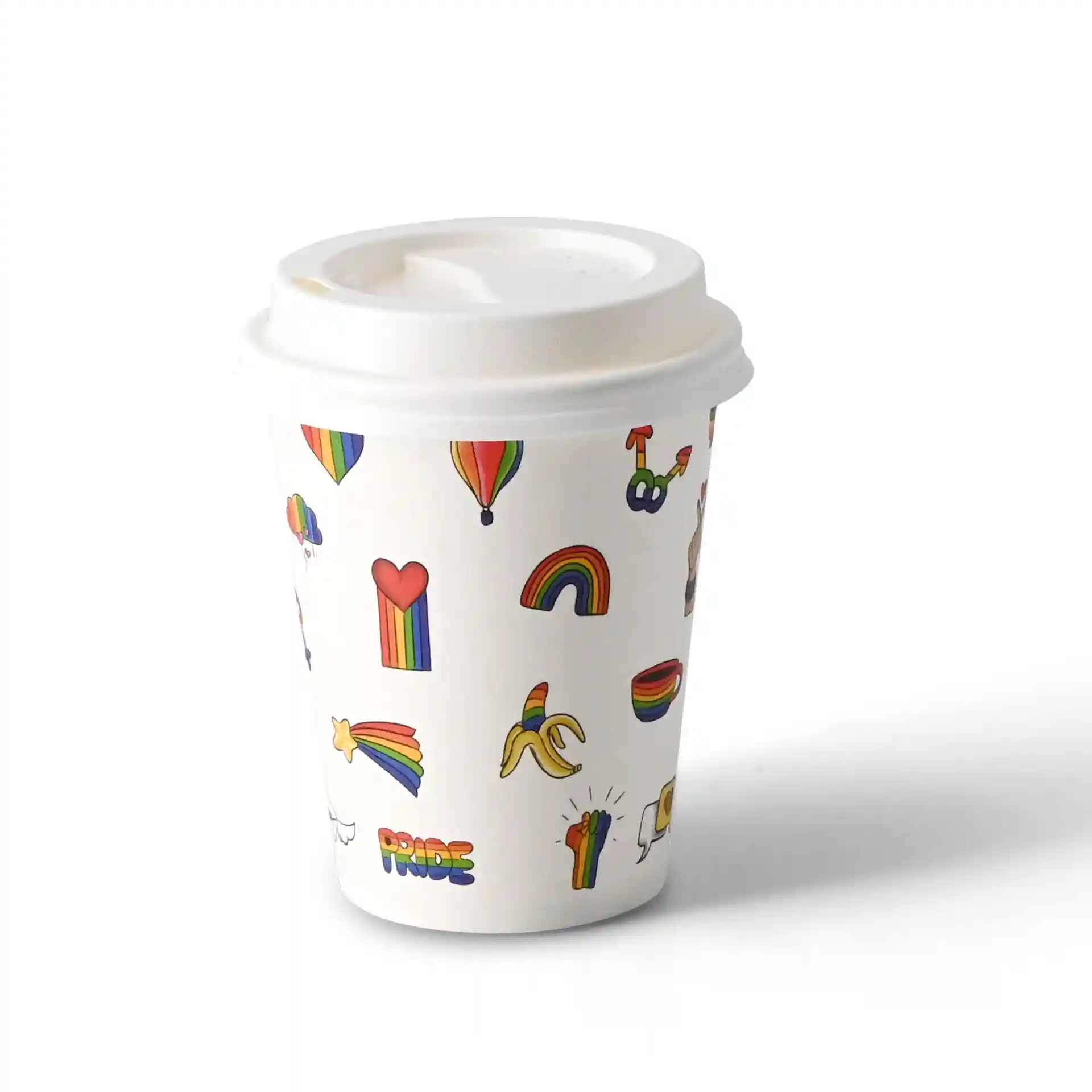 White paper cup with colorful printed designs including hearts, rainbows, and bananas, featuring a white lid.