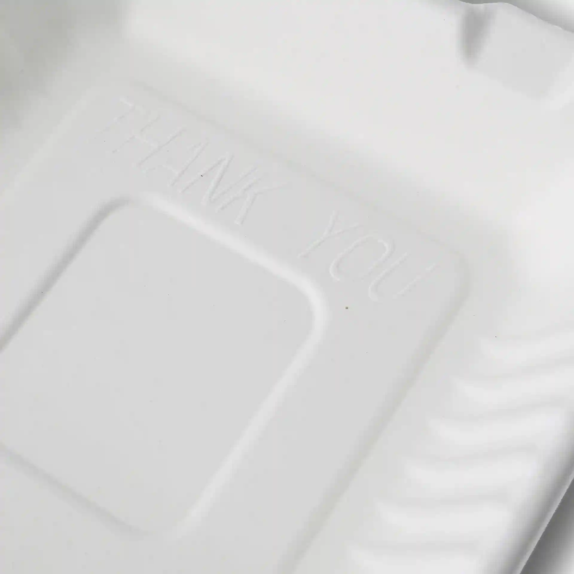 White rectangular sugarcane container with a hinged lid, featuring an embossed "THANK YOU" on the interior.