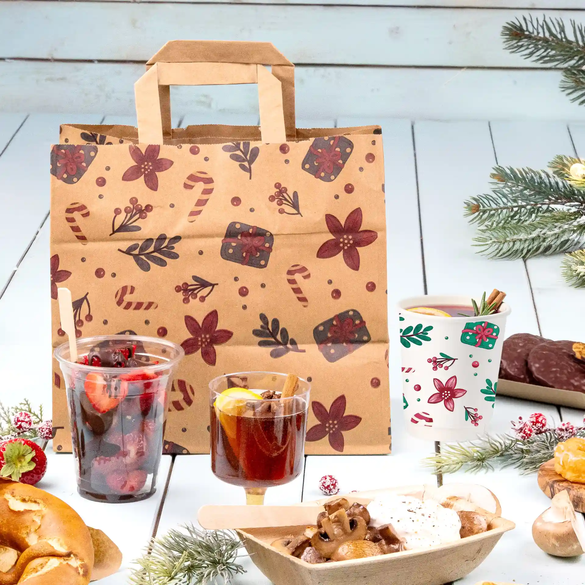 Braune Papiertasche mit Winterdesign, 26 x 17 x 25 cm, umgeben von Lebensmitteln und Dekorationen.