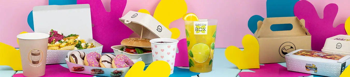 Various customizable items arranged on a turquoise surface, including a coffee cup, paper straws, a napkin, and a card with a sustainability message.