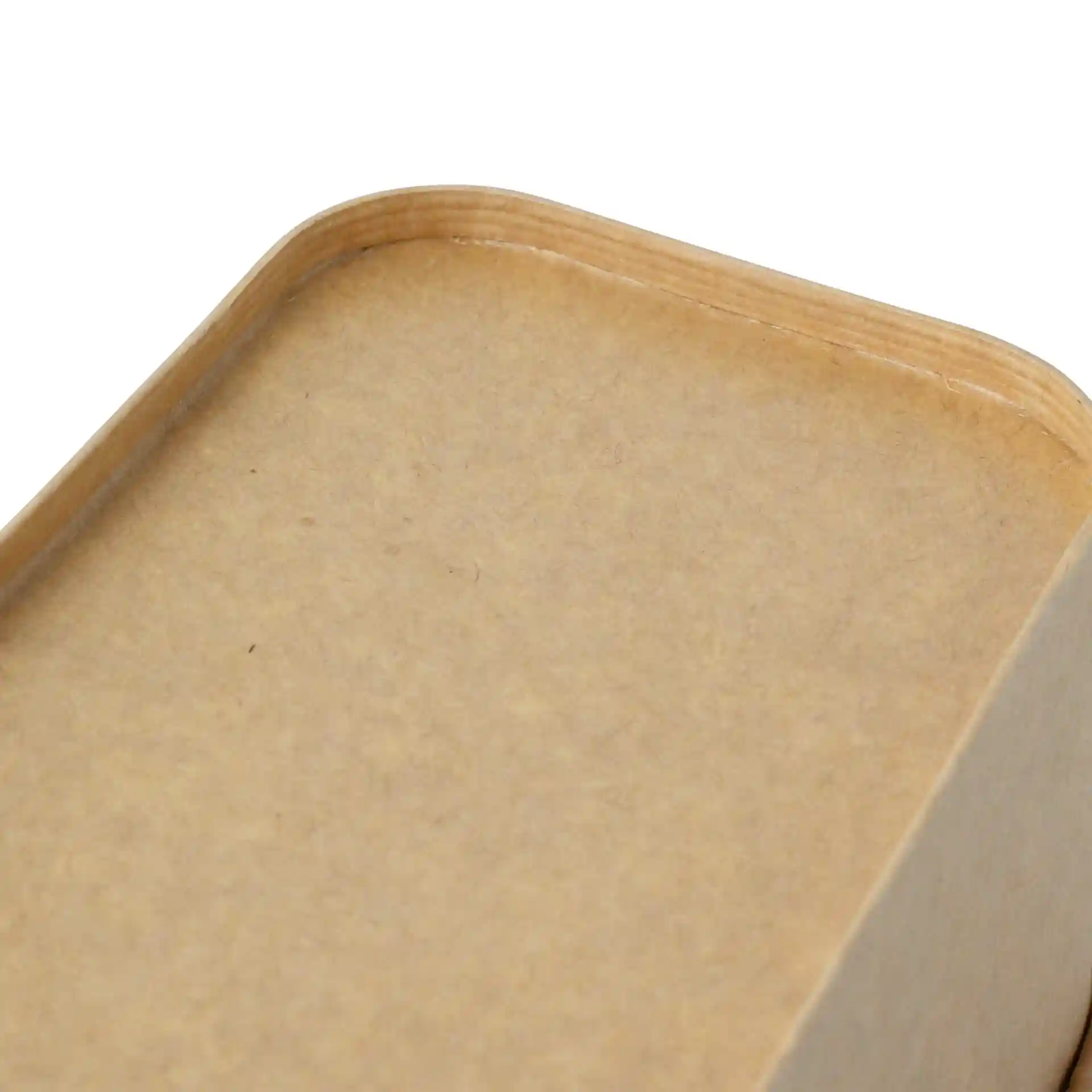 Close-up of a rectangular brown cardboard food container with a smooth edge and a flat top surface.