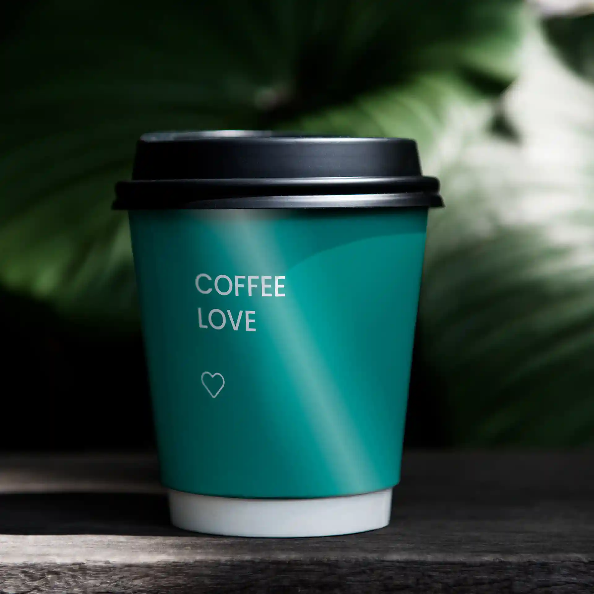 Double-walled teal paper cup with a black lid, featuring the text "COFFEE LOVE" and a heart symbol.