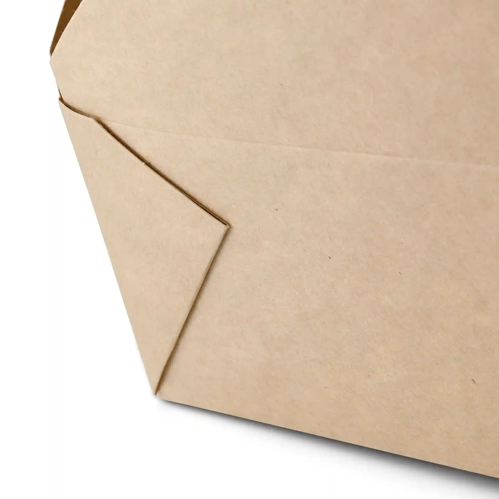 Close-up of a brown cardboard take-away box with a folded corner, showing its rectangular shape.