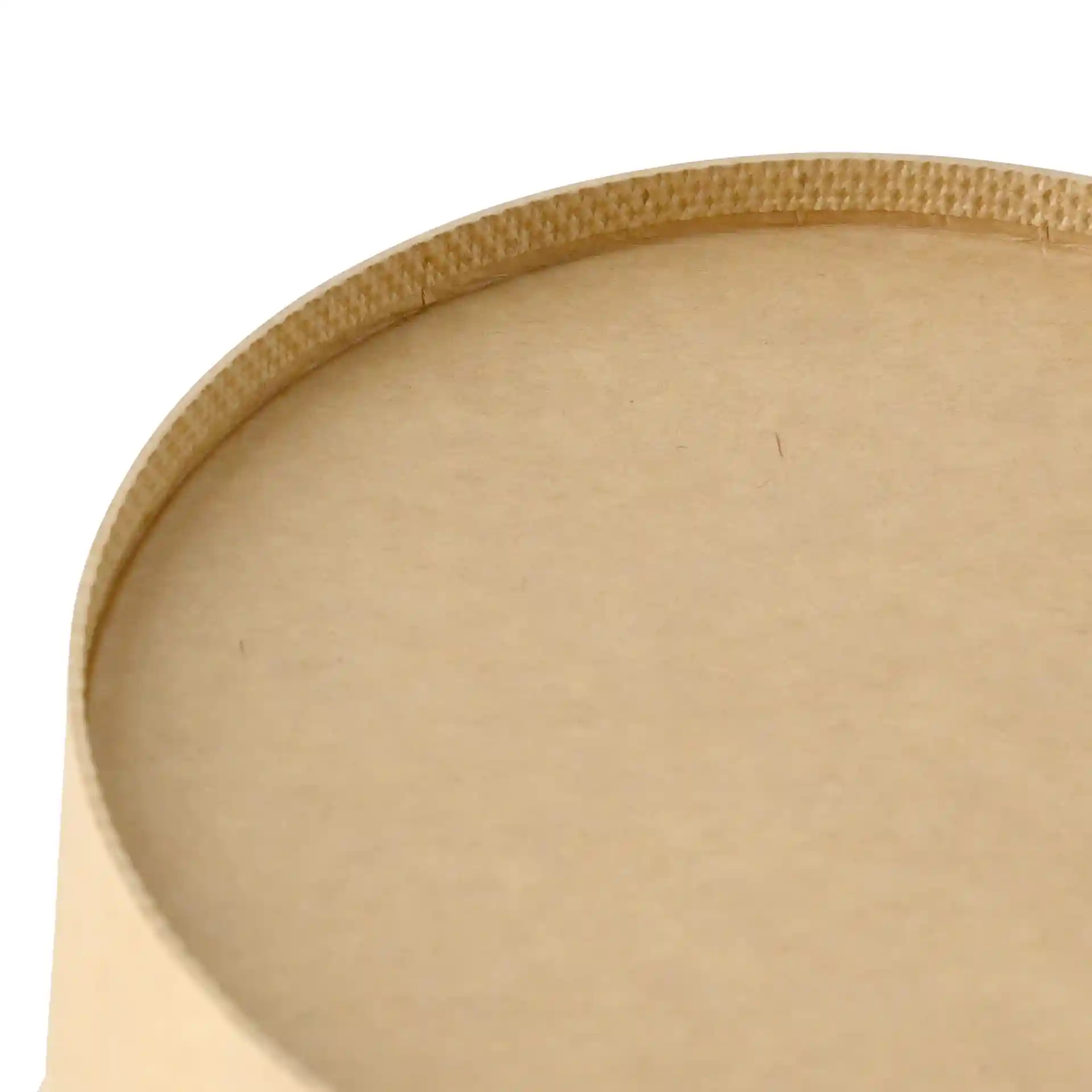 Close-up of the top edge of a round brown cardboard bowl with a smooth surface and visible seam.