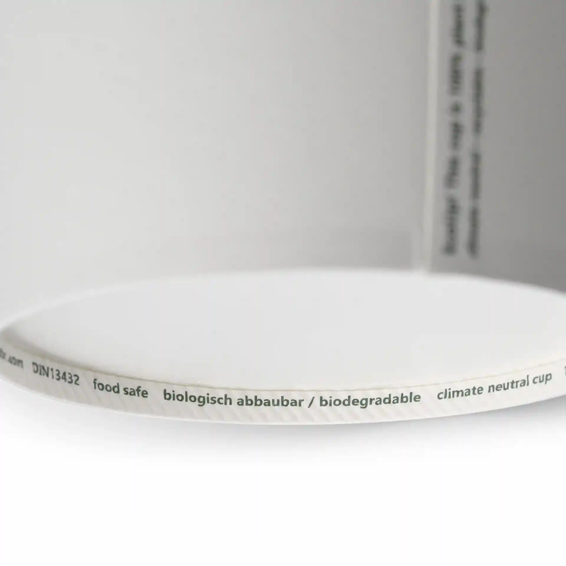 Weißer runder Papiersuppenbehälter mit einem Durchmesser von 115 mm und sichtbaren Druckmarkierungen am Rand.