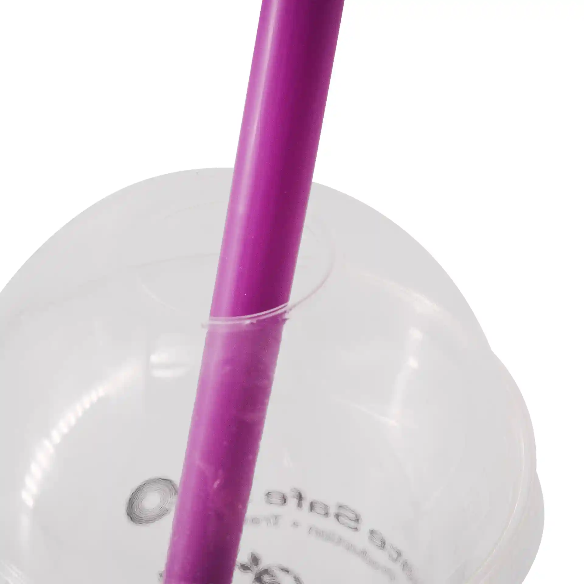 Purple reusable bubble tea straw inserted into a clear cup, with visible markings on the cup's surface.