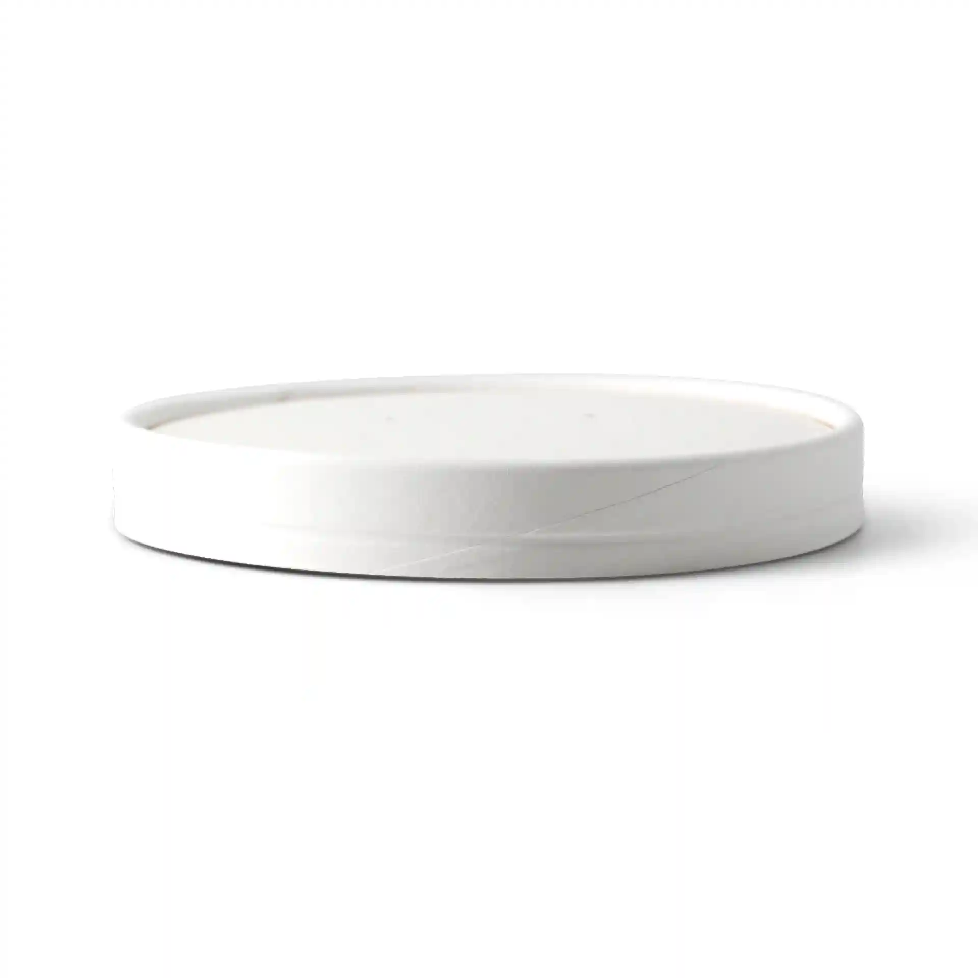 Round white lid with a smooth surface and slightly raised edge, viewed from the side.
