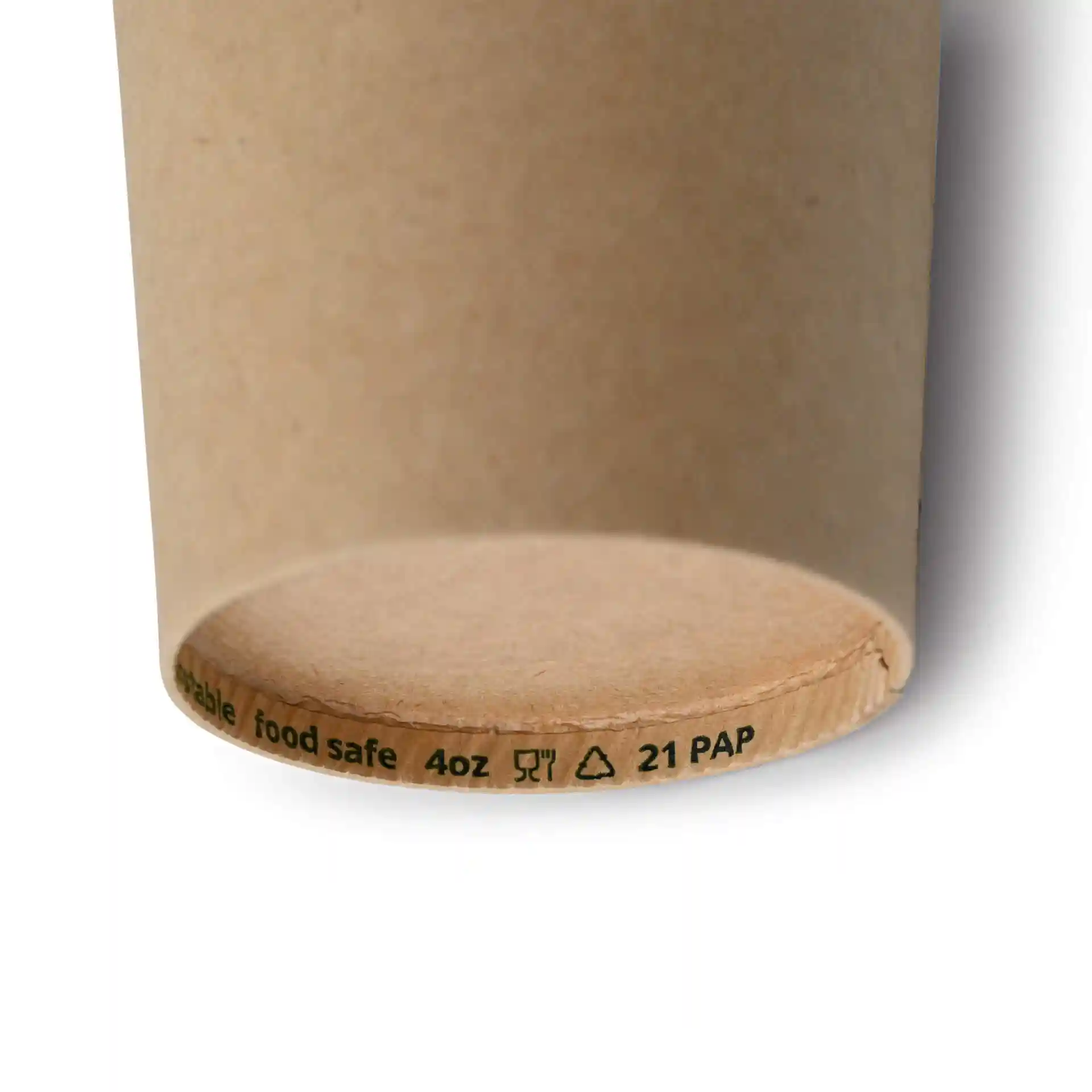 Brown paper cup with a round shape, showing the bottom edge and printed markings.