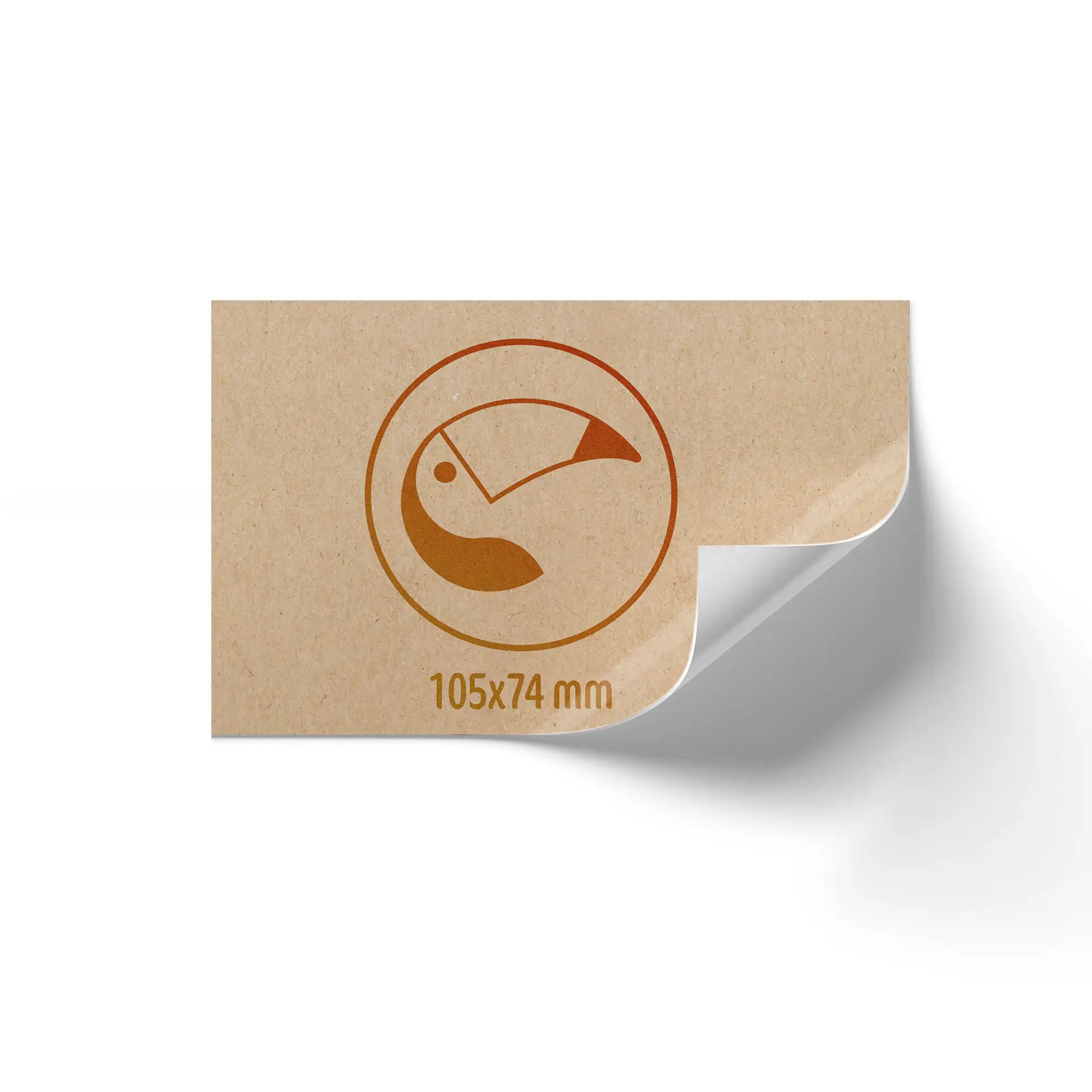 Custom printed label roll in brown matte kraft paper, featuring a curved corner and dimensions of 105x74 mm.