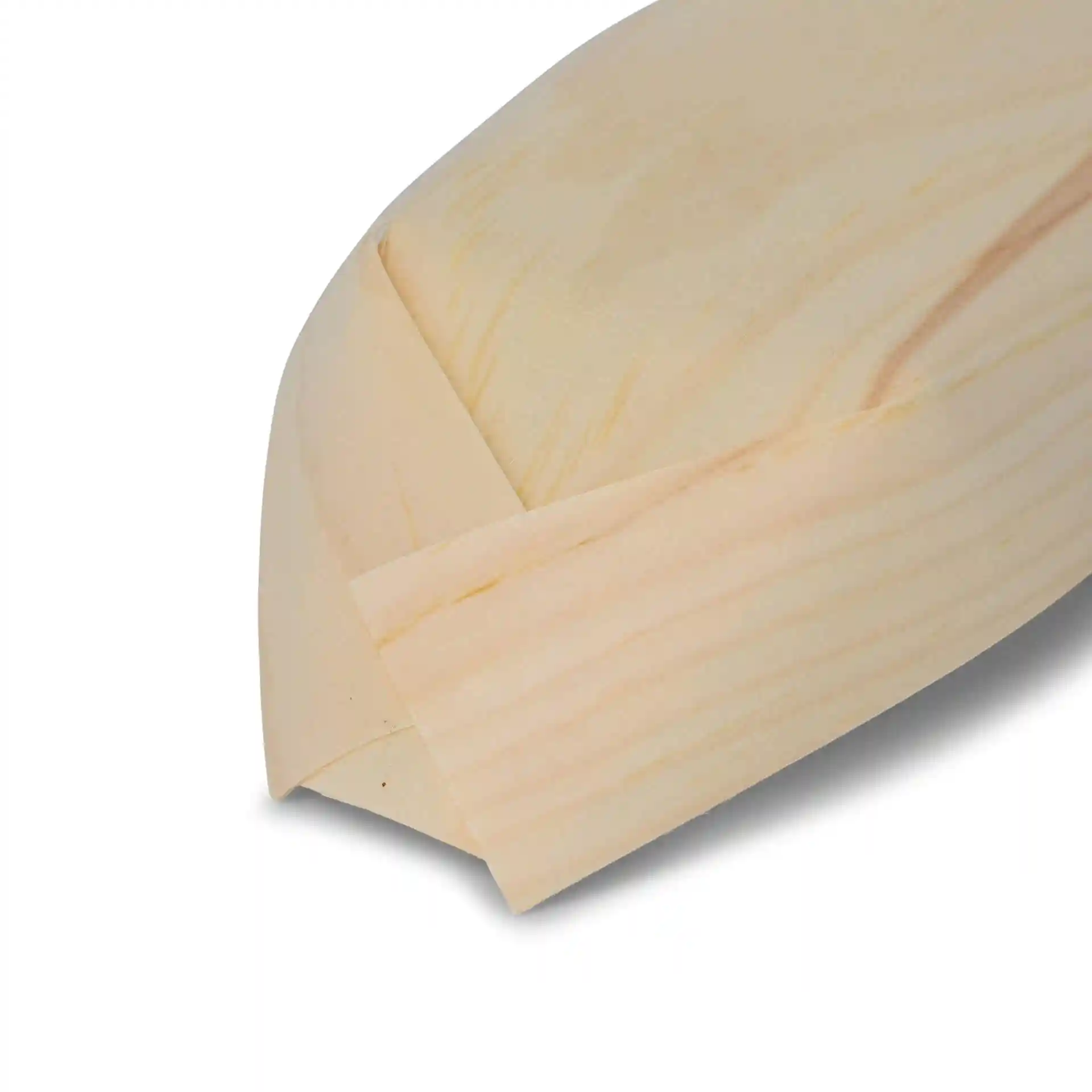 Wooden boat-shaped item with a smooth, light wood finish, showing the pointed end and a flat base.