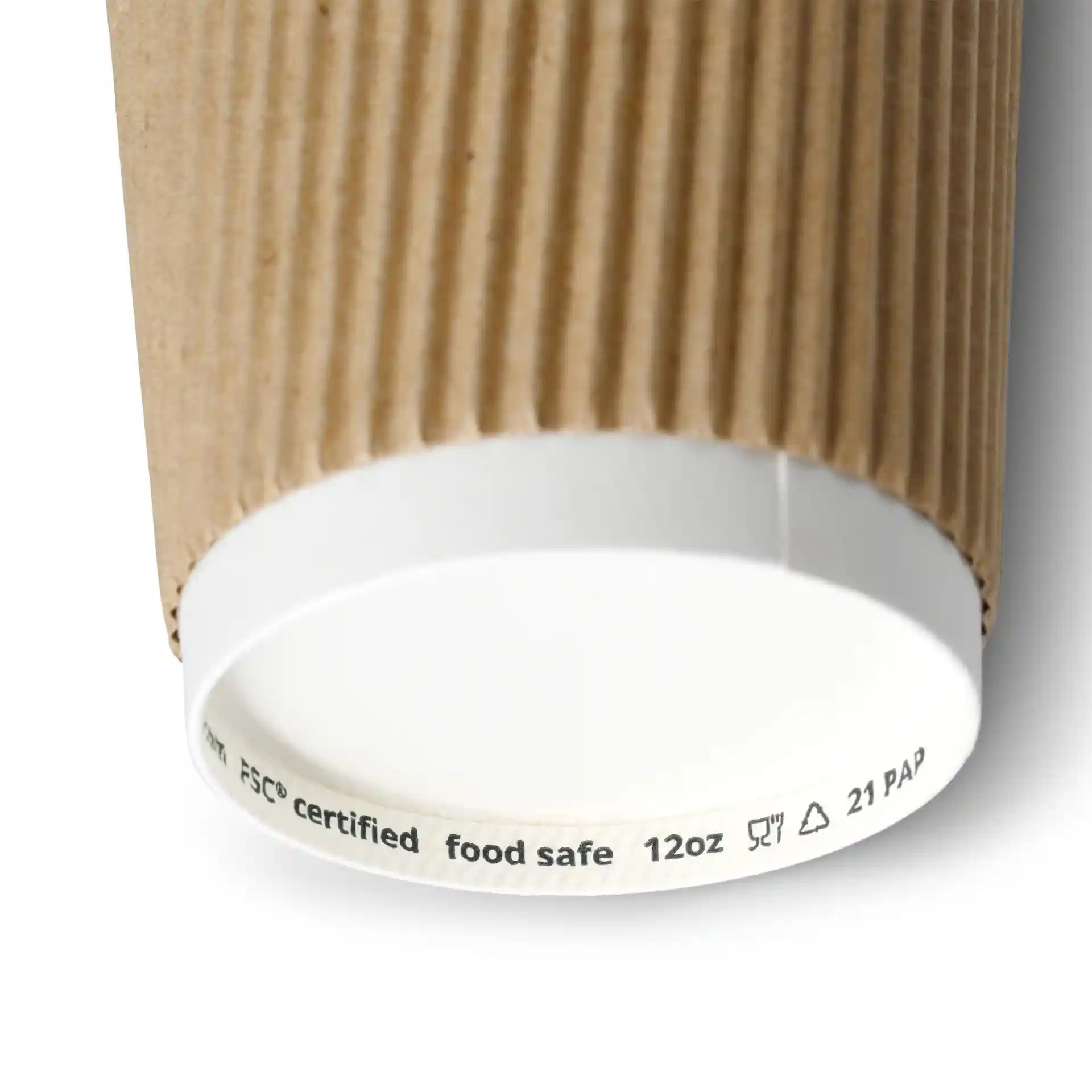 Brown ripple coffee cup with a white inner lining, showing the bottom edge and printed markings.