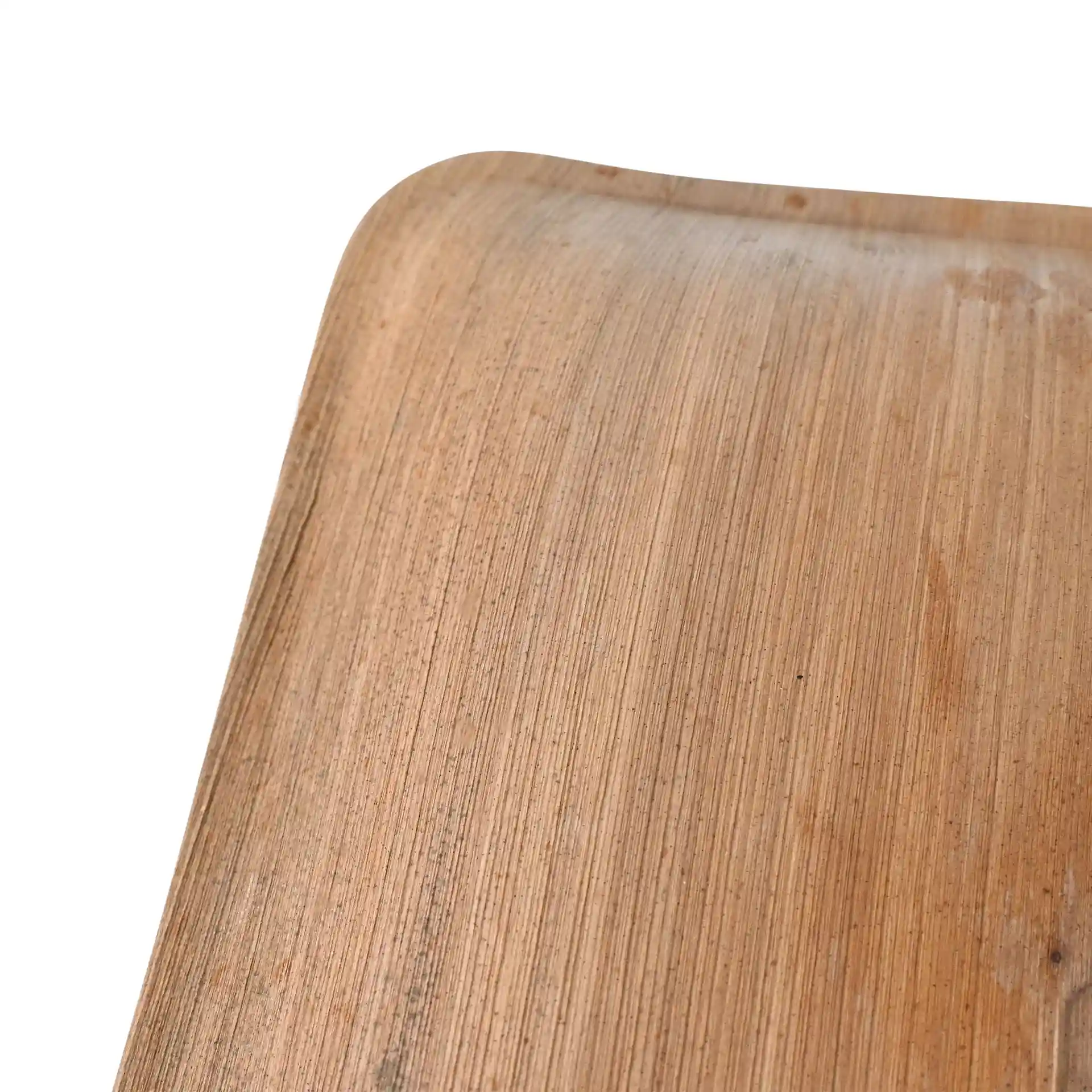 Close-up of a square palm leaf plate with a natural grain texture on a white background.