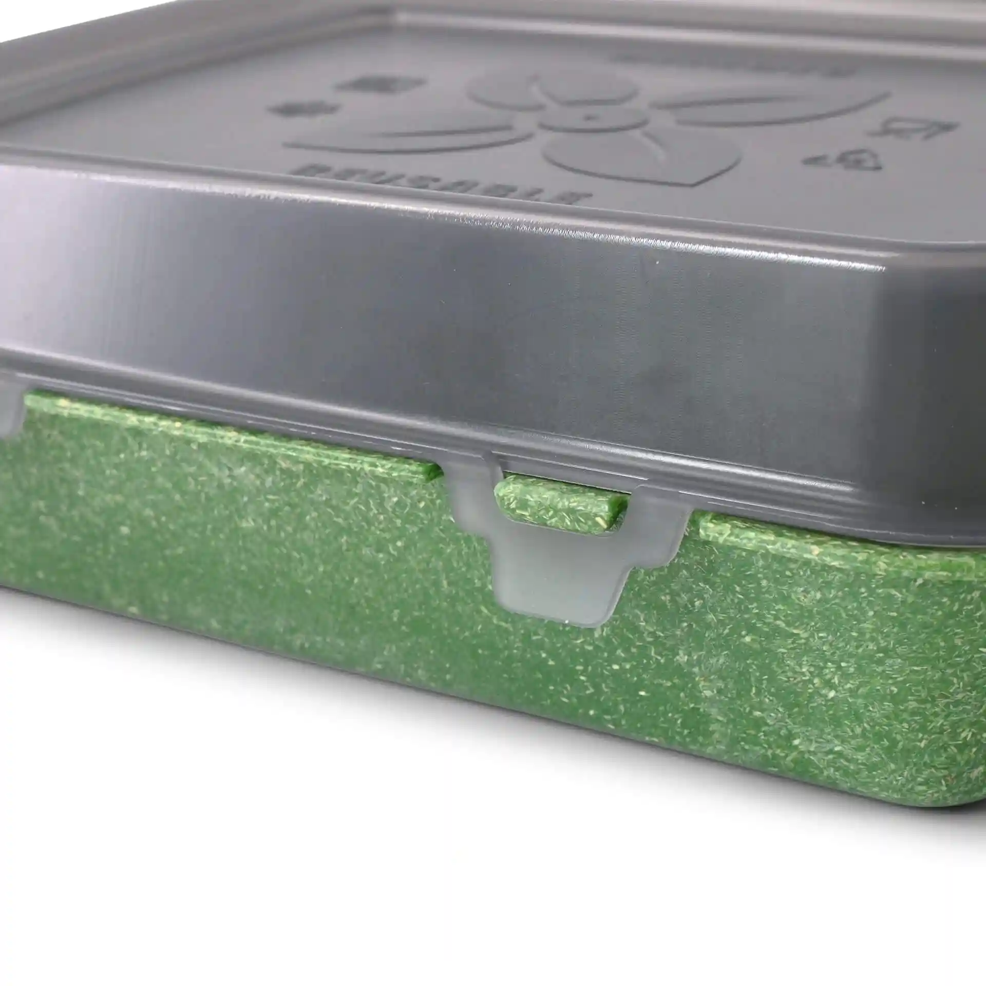 Rectangular reusable container with a grey lid and a green base, featuring a clip closure.