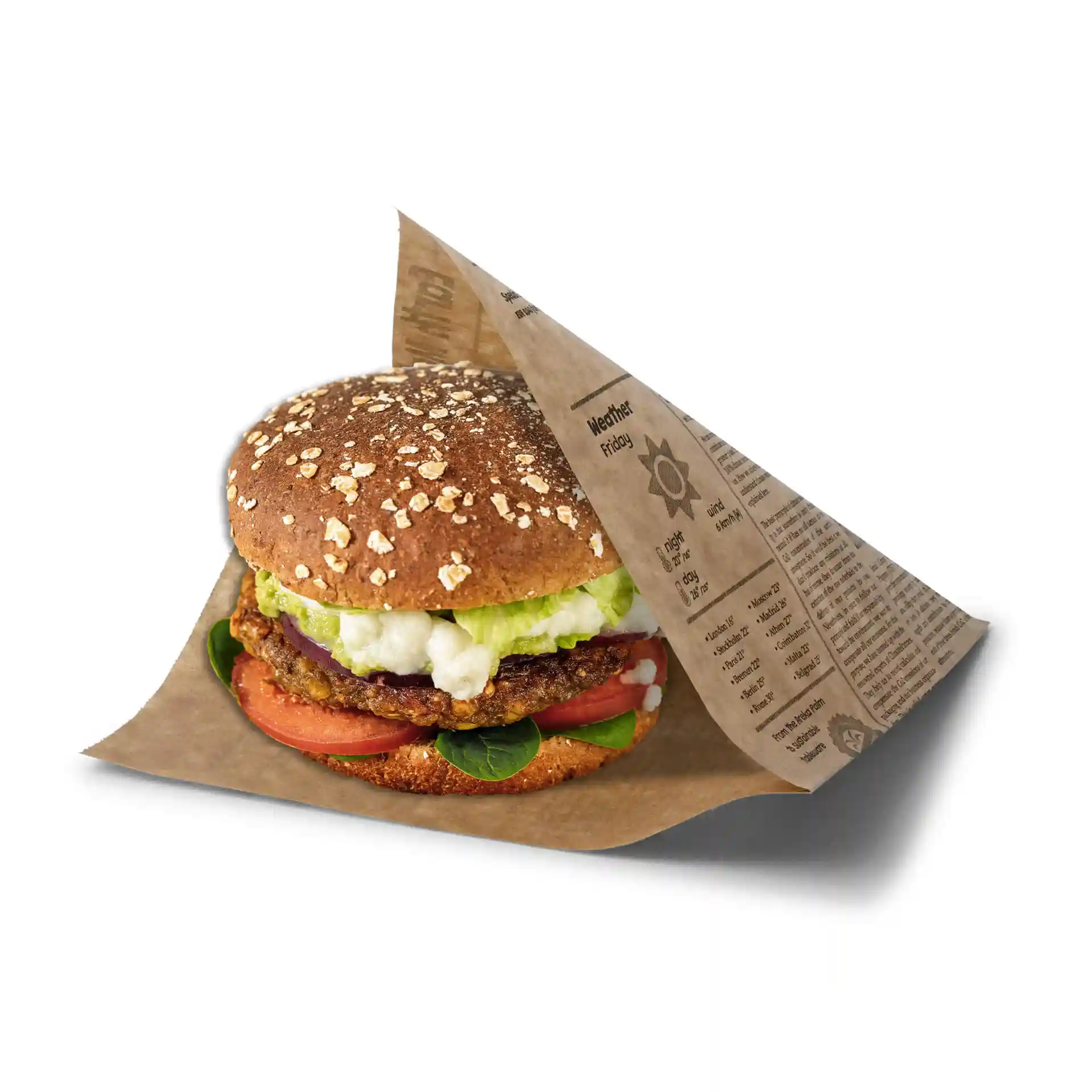 Burger wrapped in printed paper with a newspaper design, featuring lettuce, tomato, and a whole grain bun.