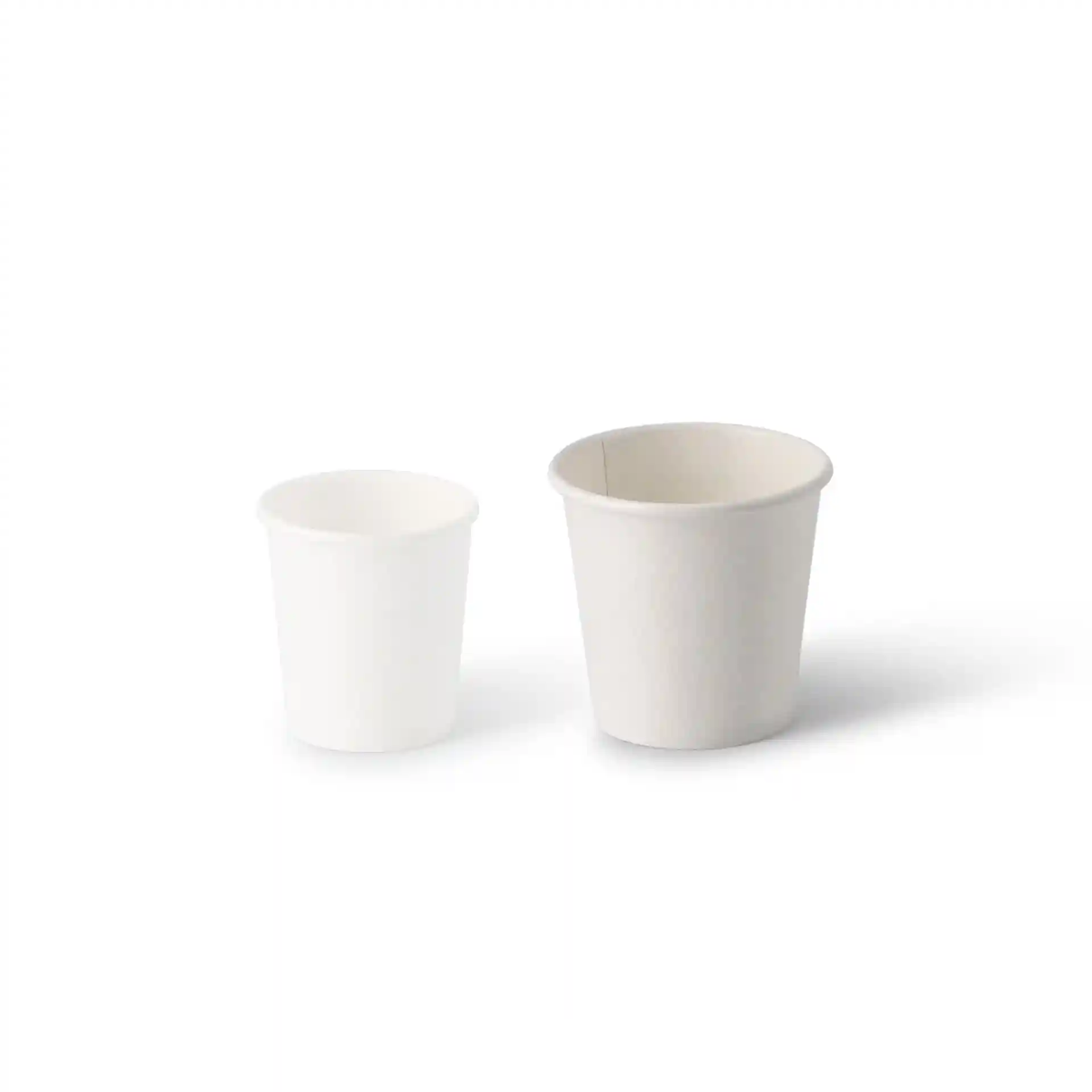 Image of two paper shot cups, one smaller and white, the other larger and coated, both on a plain background.