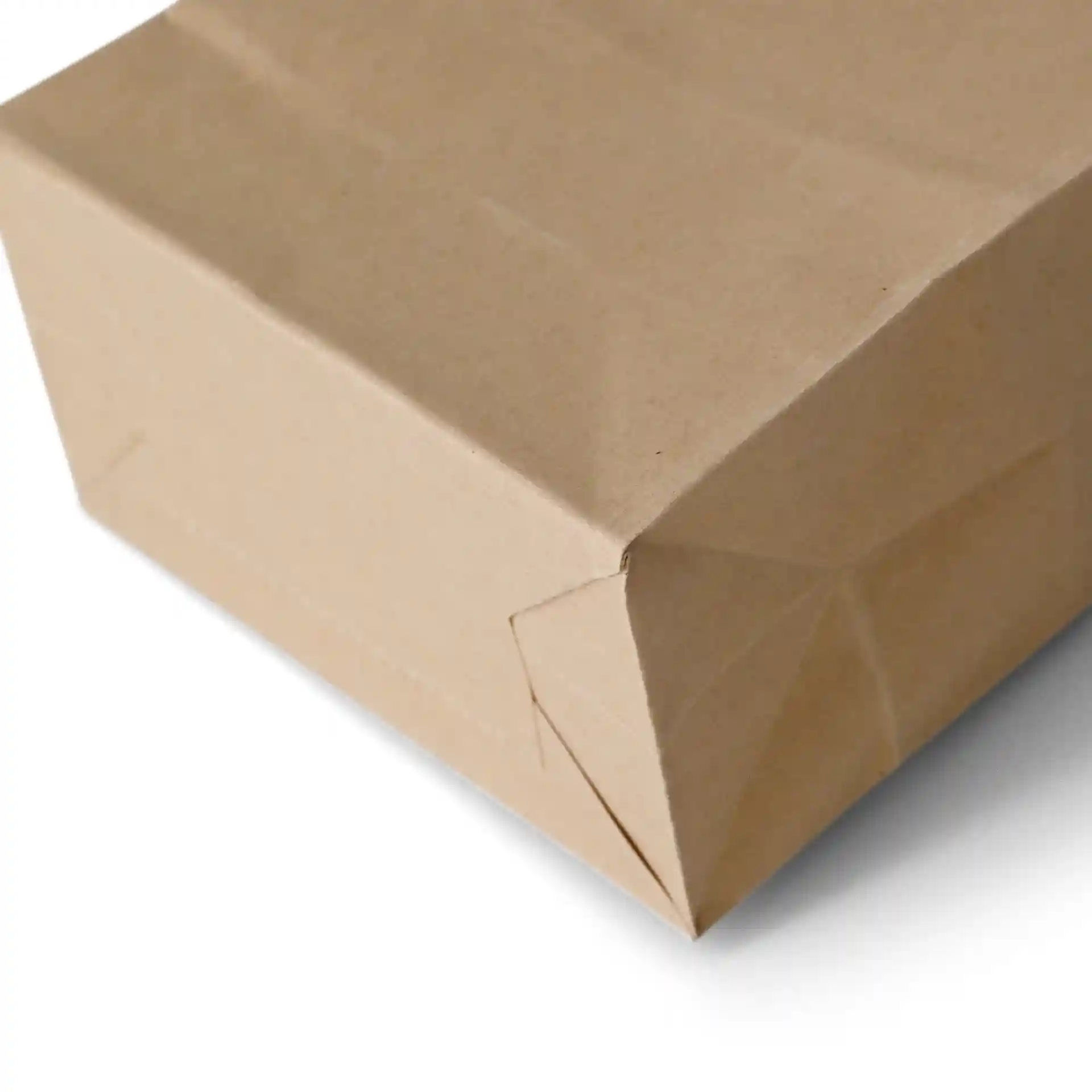 Brown kraft paper block bottom bag with a tin tie, showing the folded corner and bottom structure.