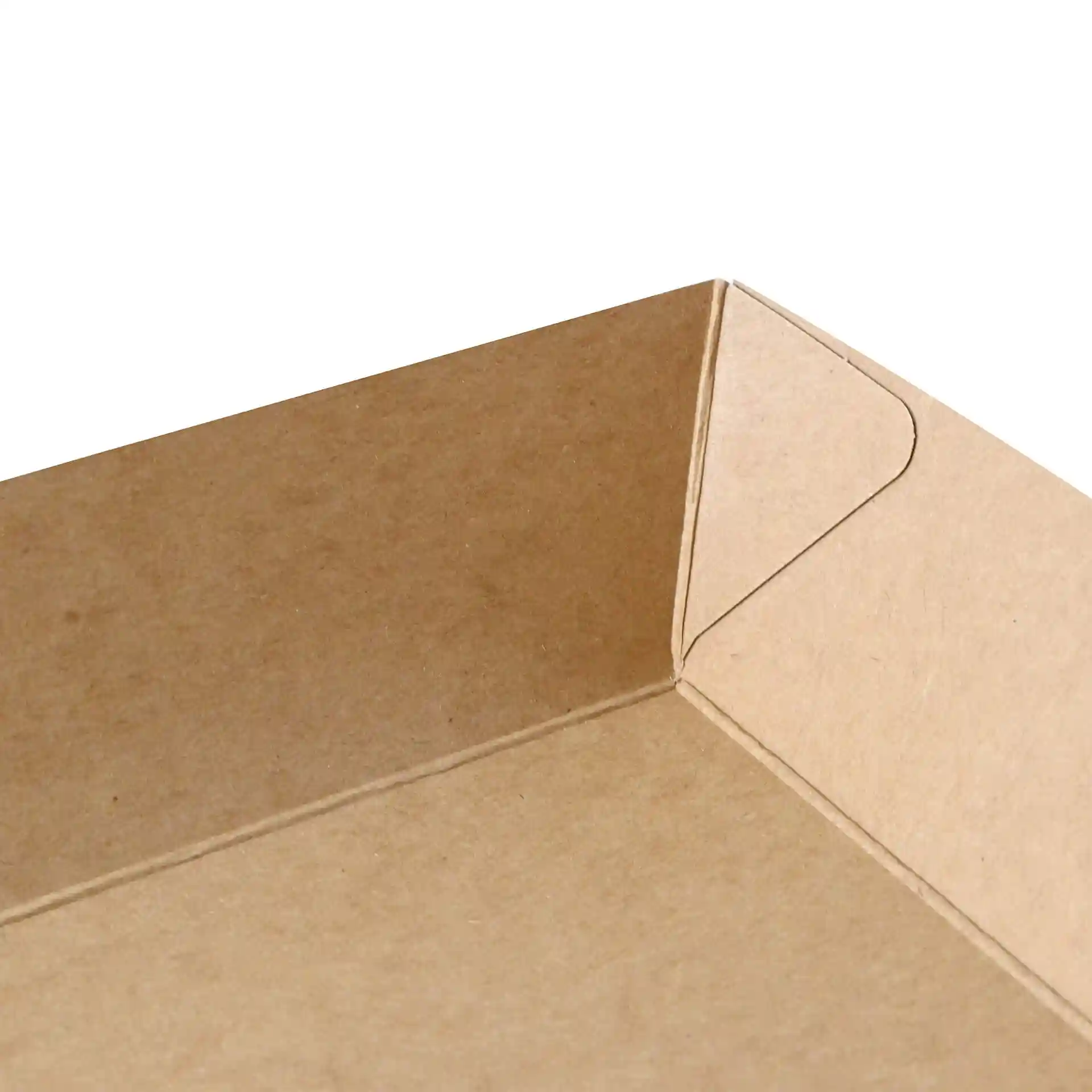 Close-up of a brown cardboard tray corner, showing the folded edge and rectangular shape.