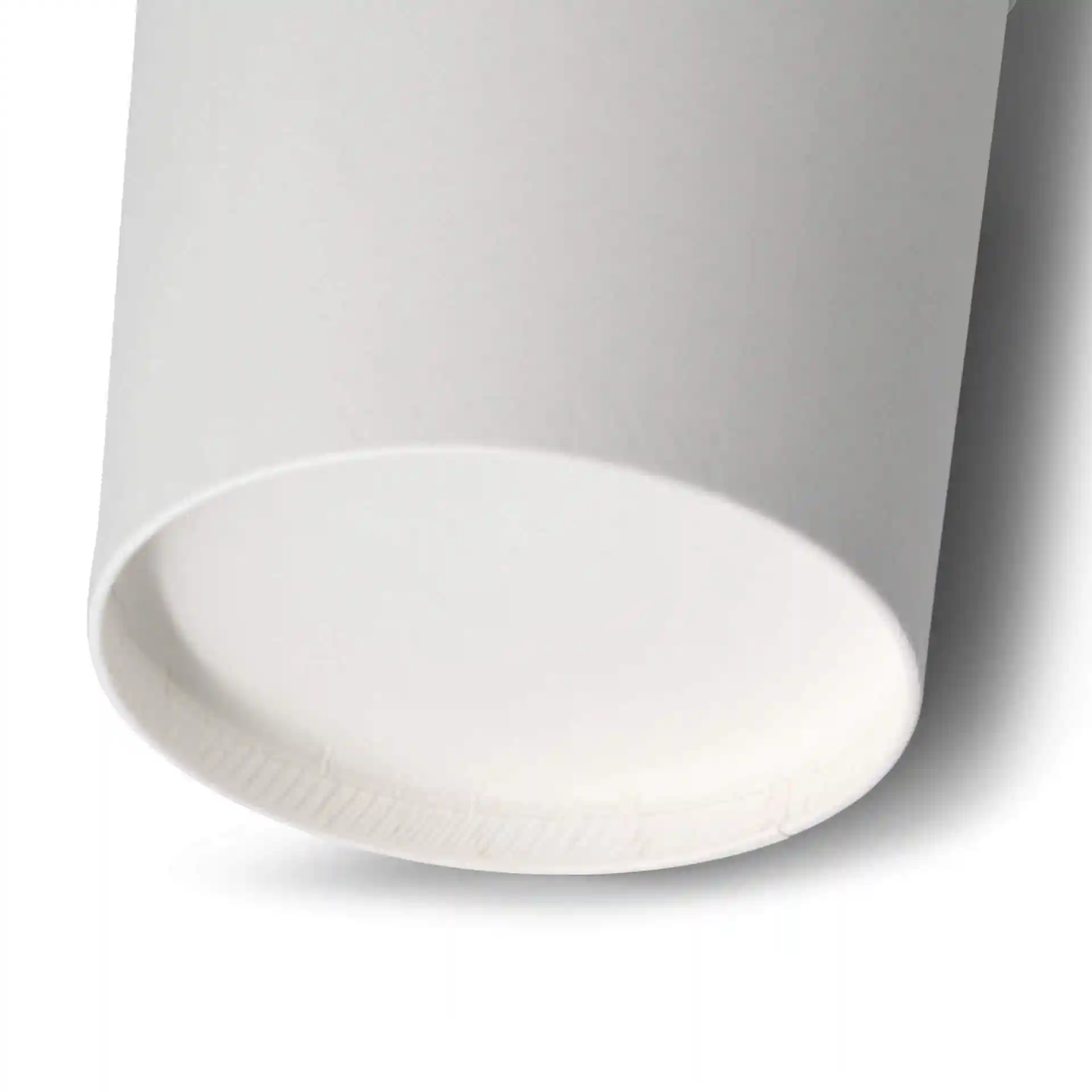 Close-up of the bottom of a white cardboard soup cup with a round shape and visible eco-friendly coating.