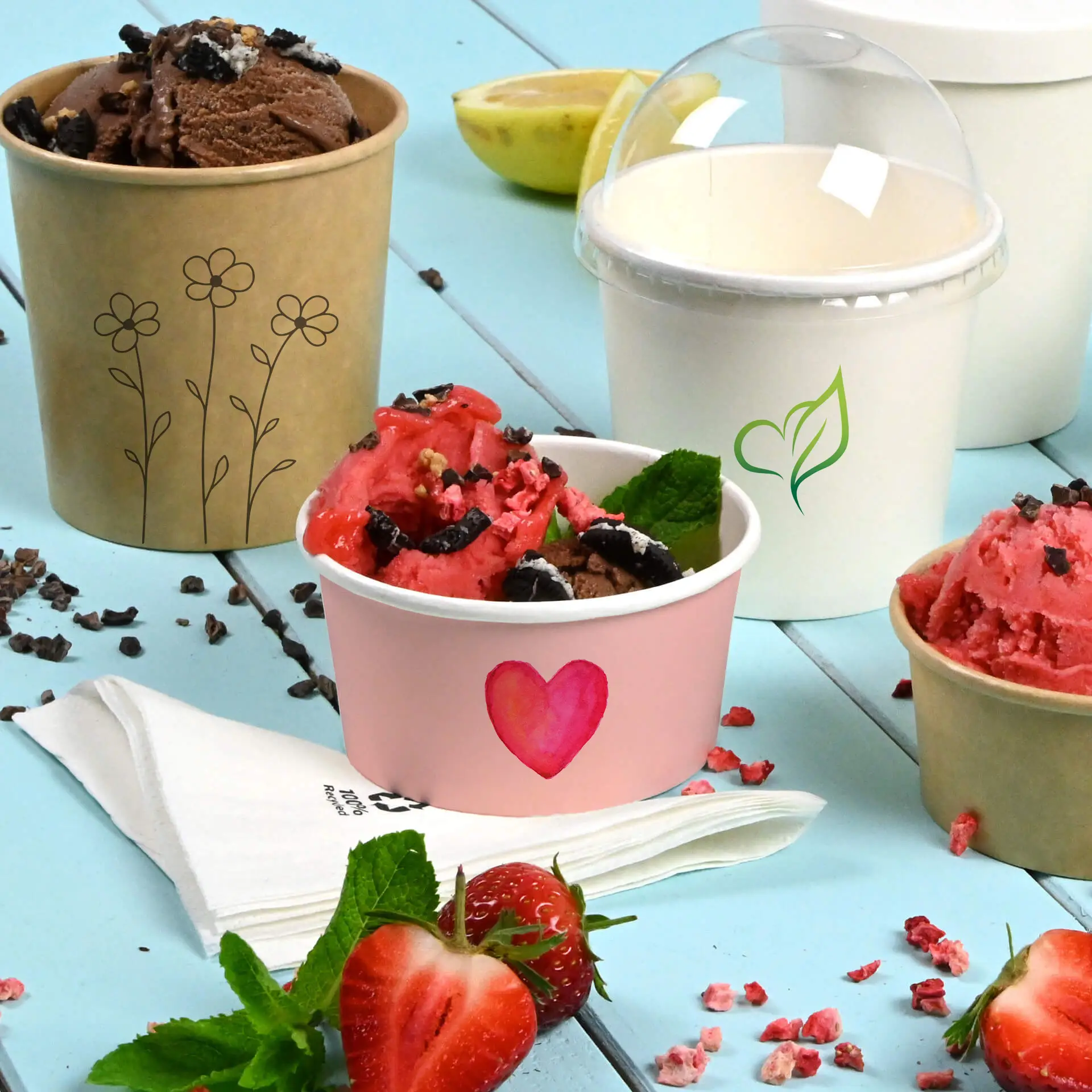 Image features colorful ice cream cups, including a pink cup with a heart design, a brown cup with flowers, and a white cup with a green leaf.