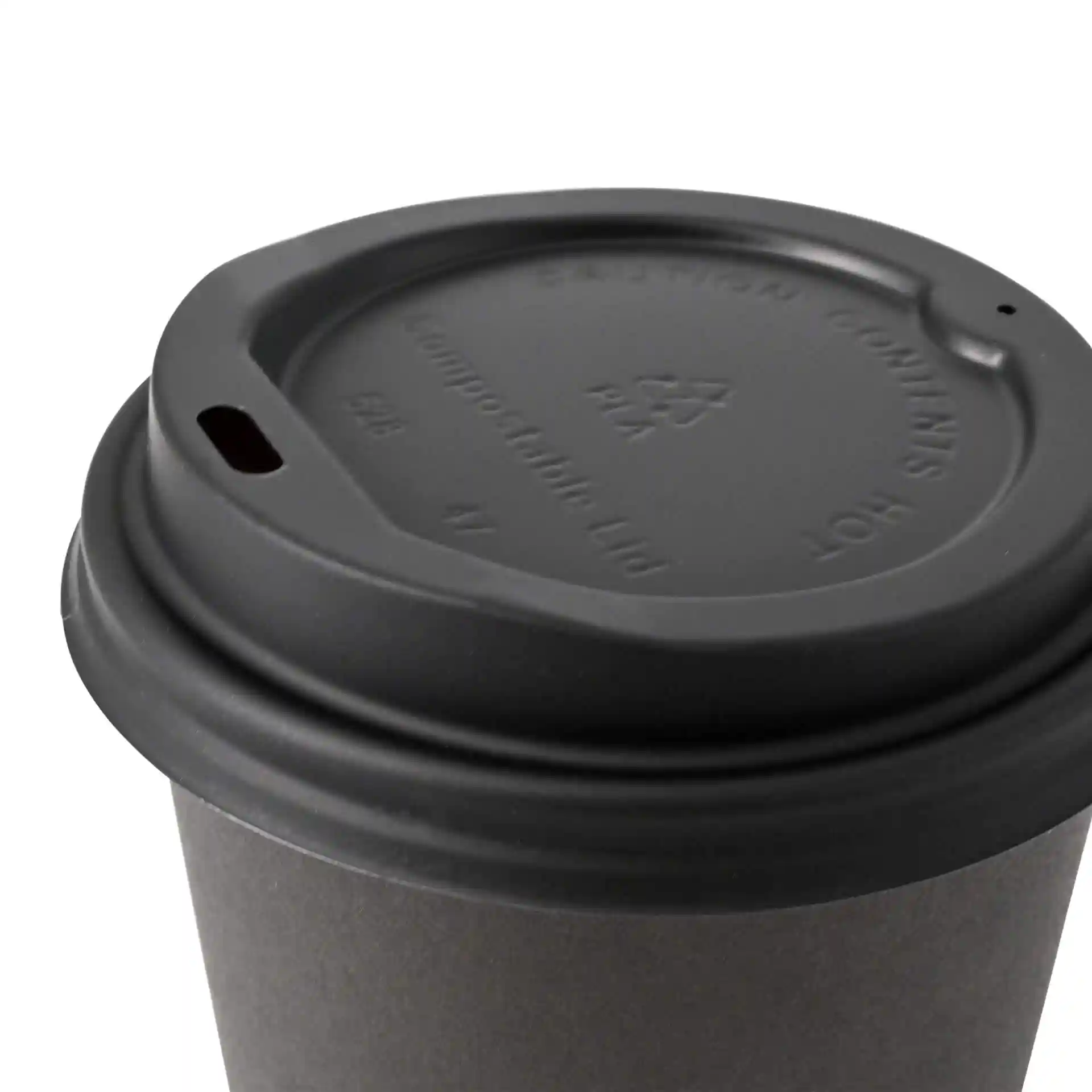 Black CPLA lid with a drinking hole, designed for a cup, showing the top view and details on the surface.