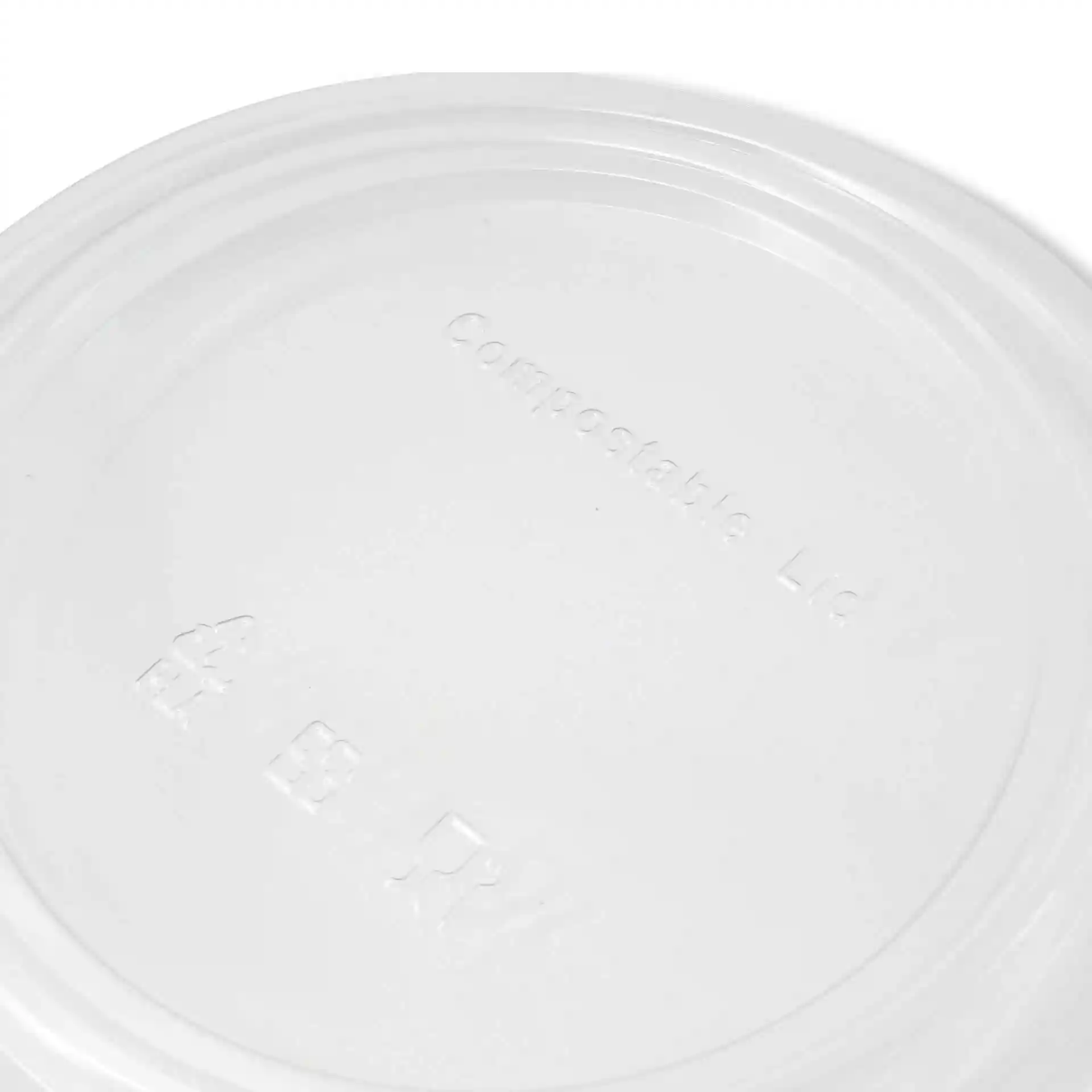 Transparenter runder Deckel aus PLA mit geprägten Markierungen auf der Oberfläche.