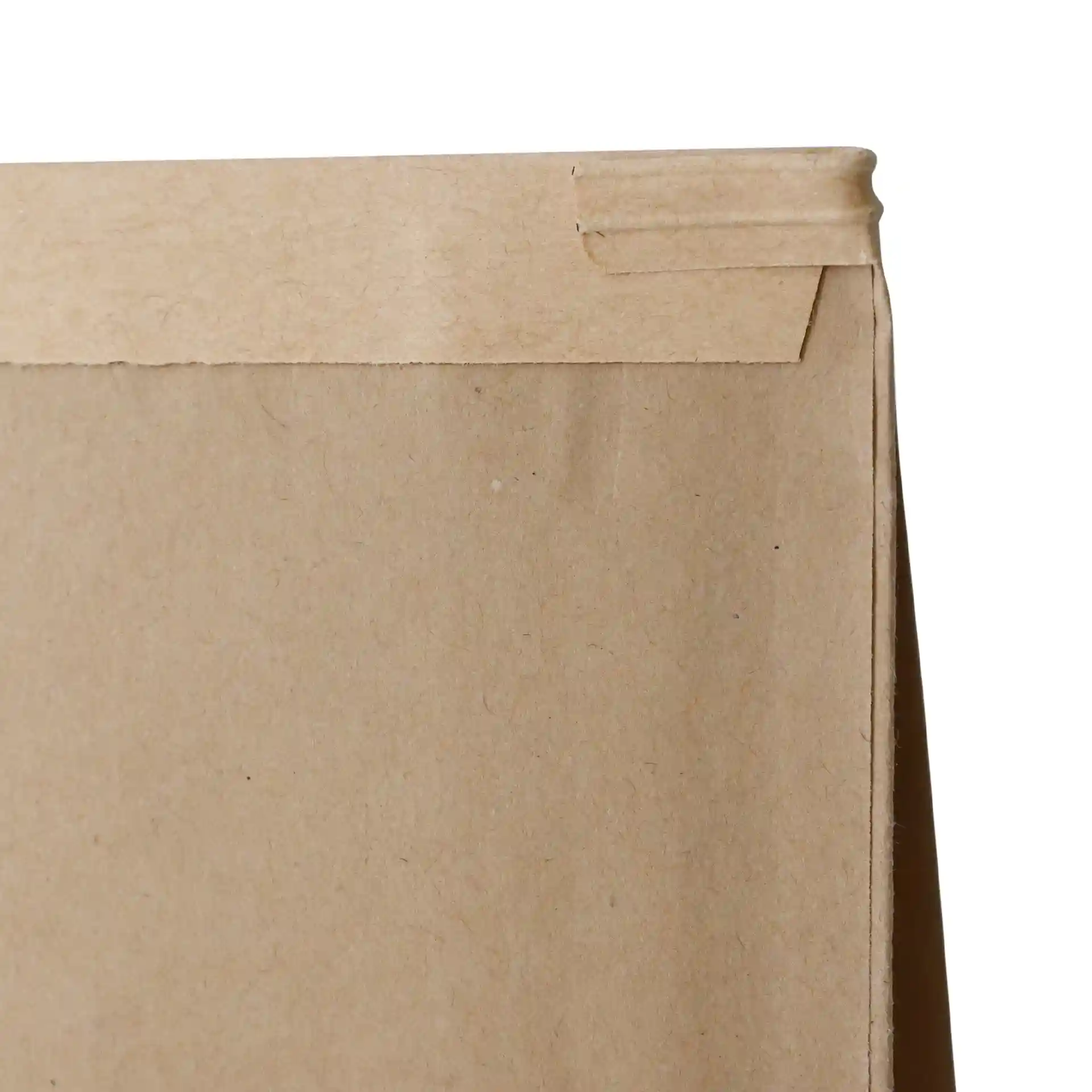 Brown kraft paper block bottom bag with a tin tie closure, showing the top edge and fold.