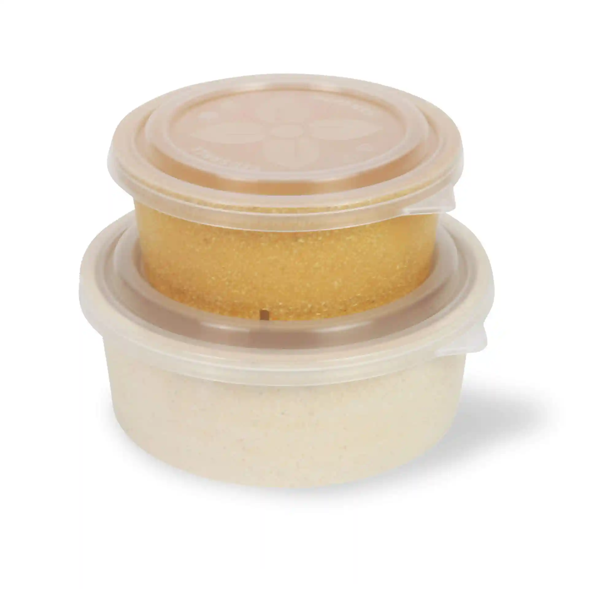 Two round containers with transparent lids, one containing yellow contents and the other with white contents.