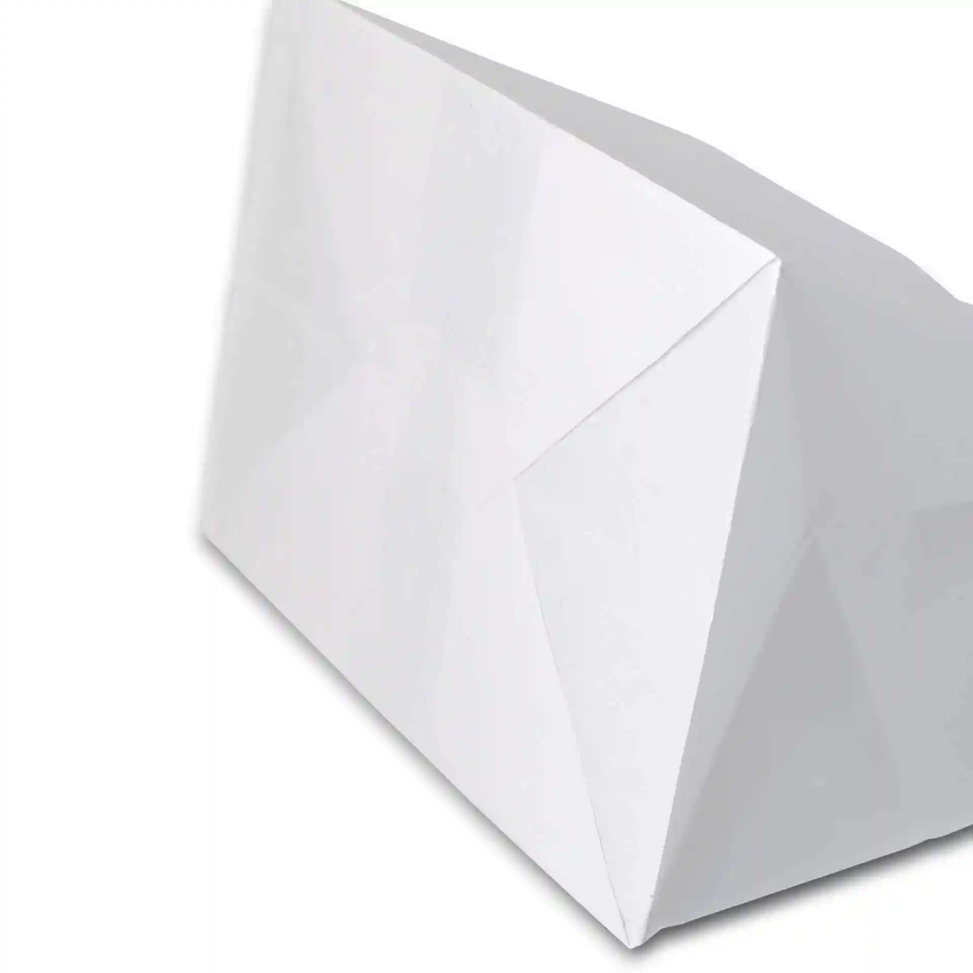 White kraft paper carrier bag with a wide base, showing a folded corner and angled view.