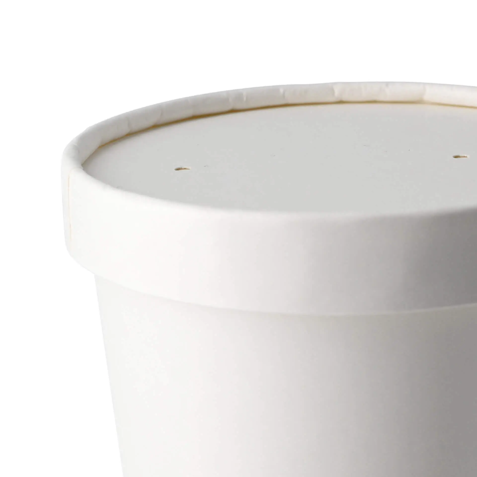 White cardboard membrane lid with steam escape holes, suitable for biodegradable food containers.