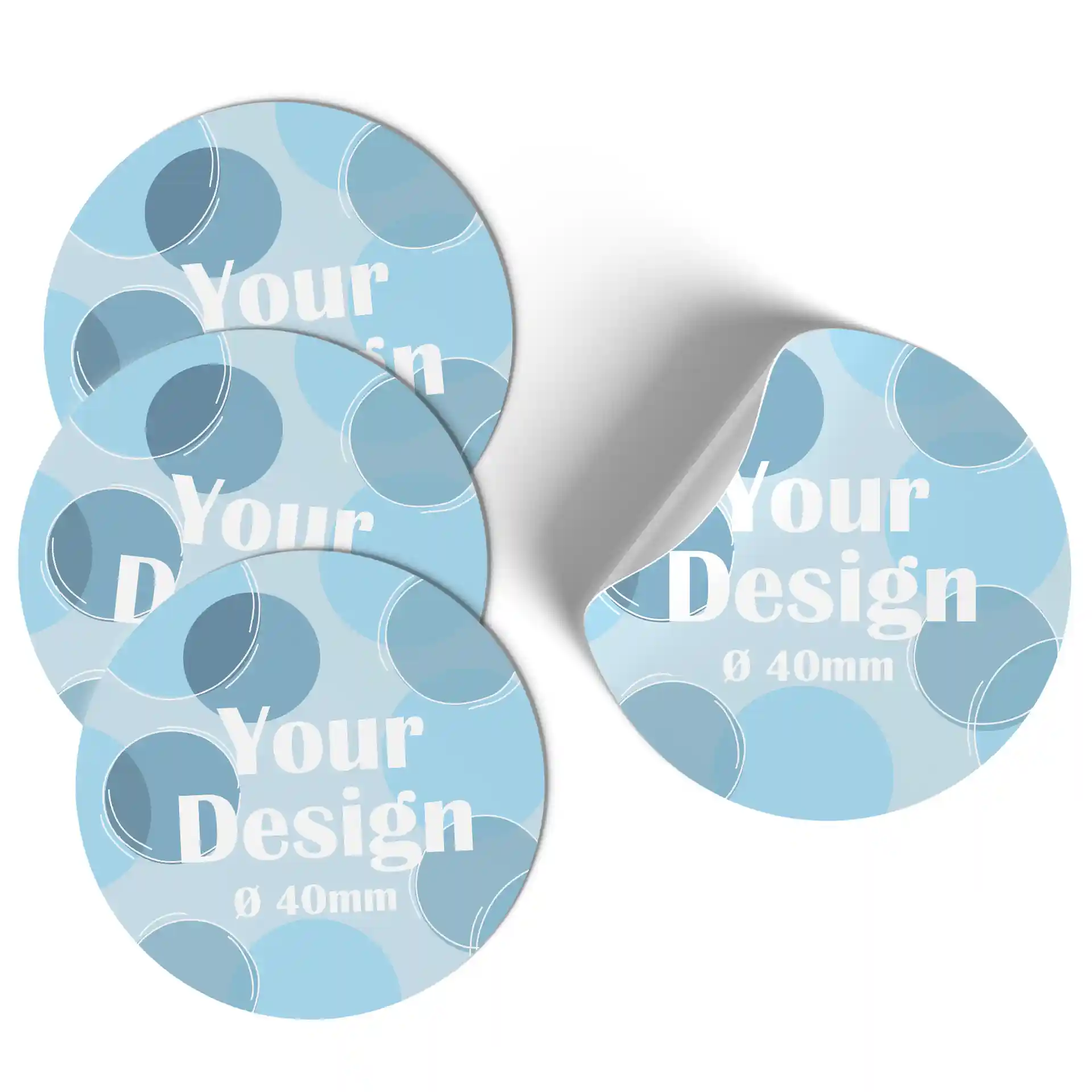 Round printed labels in blue tones with white text, measuring 40 mm in diameter, showing a slight curl on one edge.