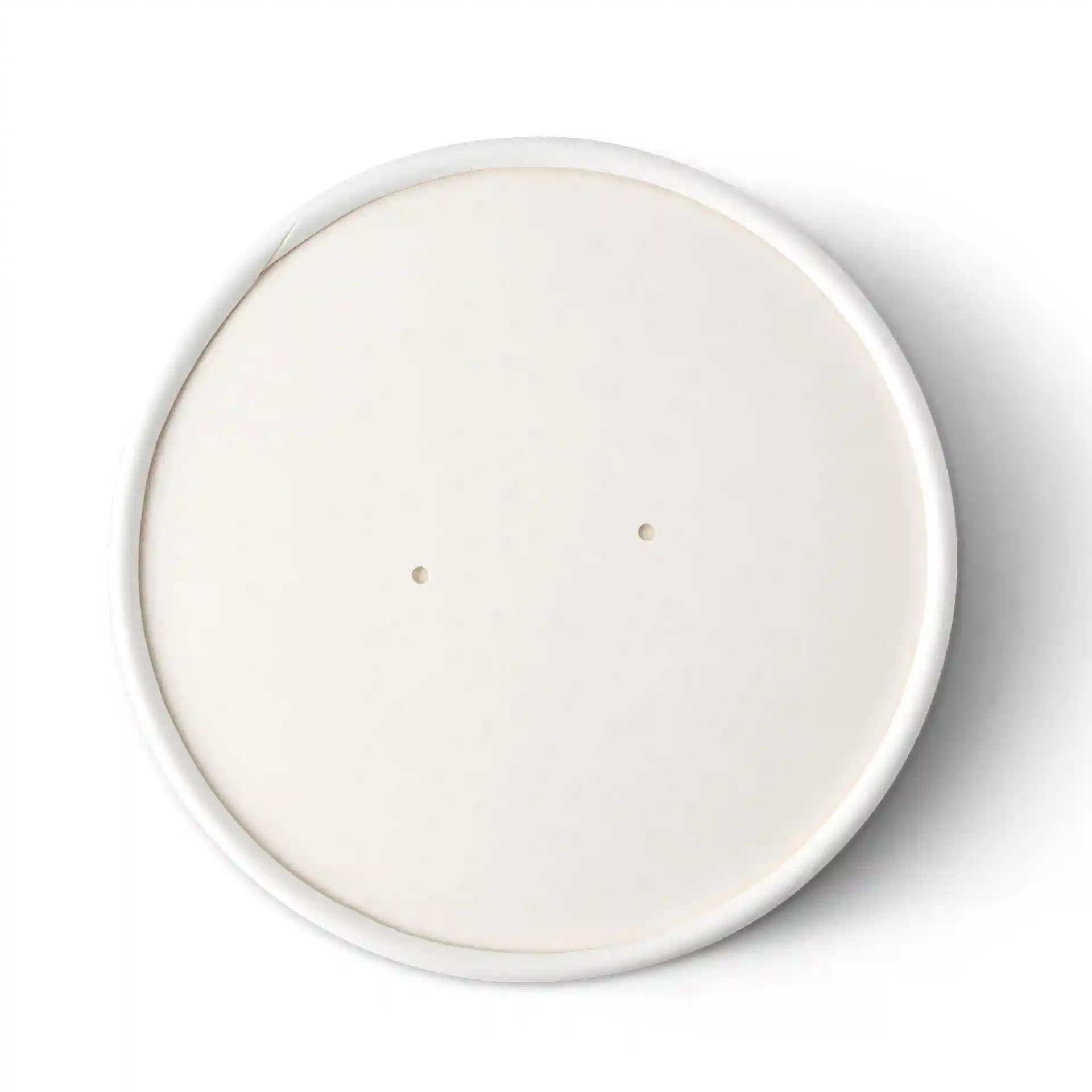 Round white plate with a smooth surface and two small holes on the edge.