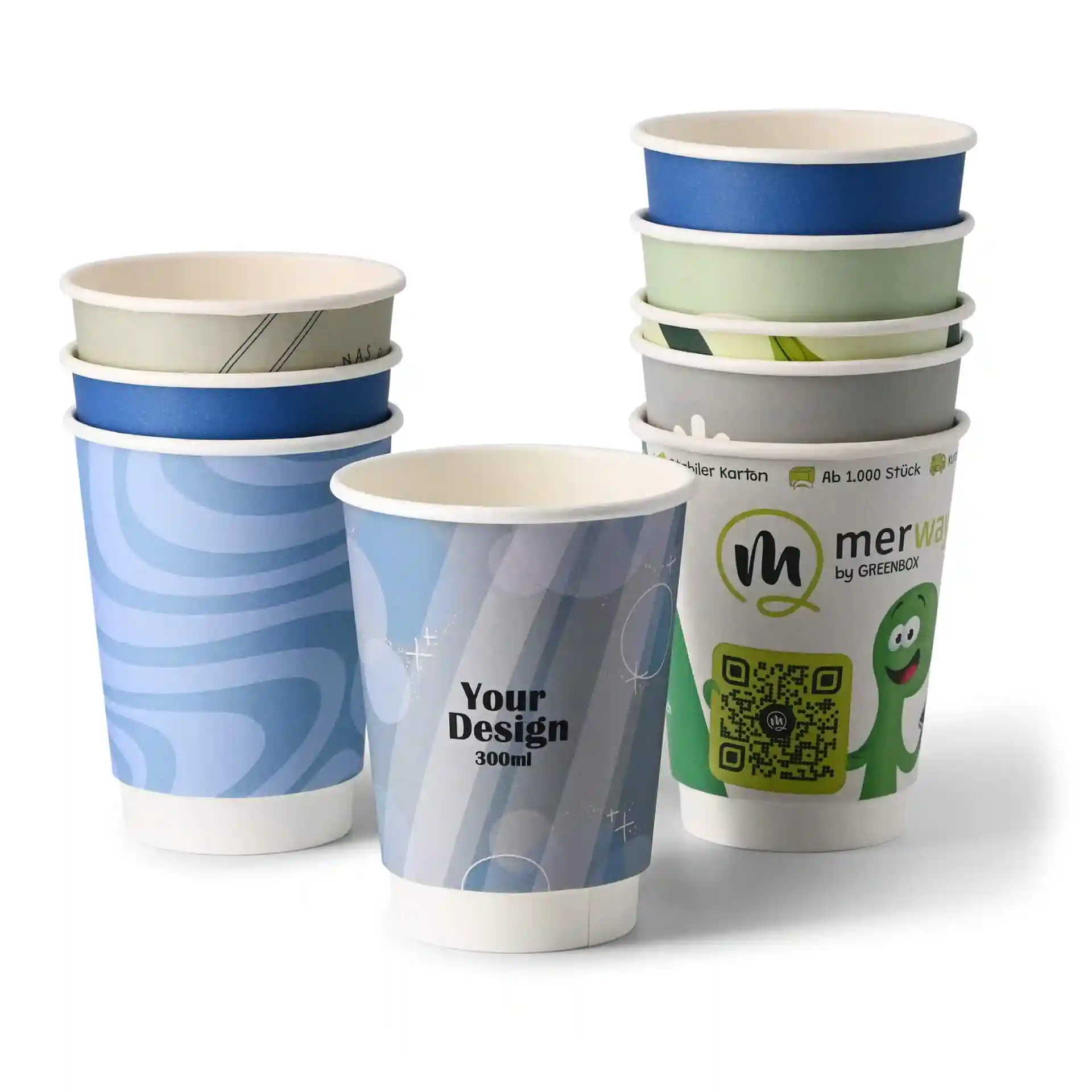 Stack of custom printed paper cups in various designs, featuring a blue swirl, a grey cup, and a green character design.