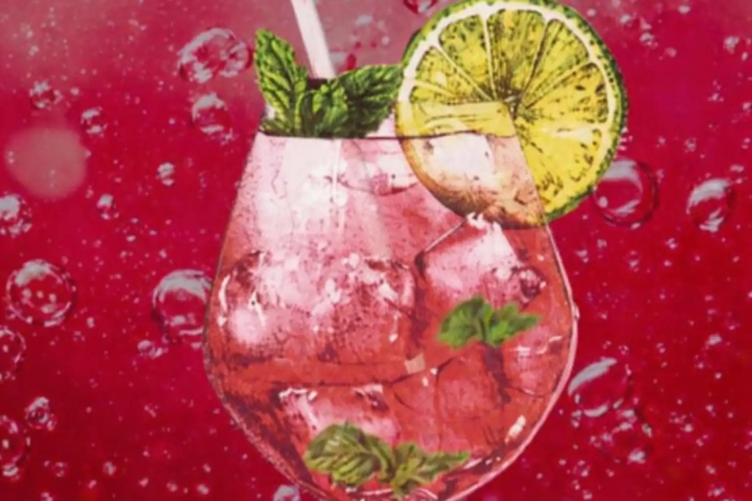 Cocktail in a glass with ice, mint leaves, and a lime slice, against a pink background with bubbles.