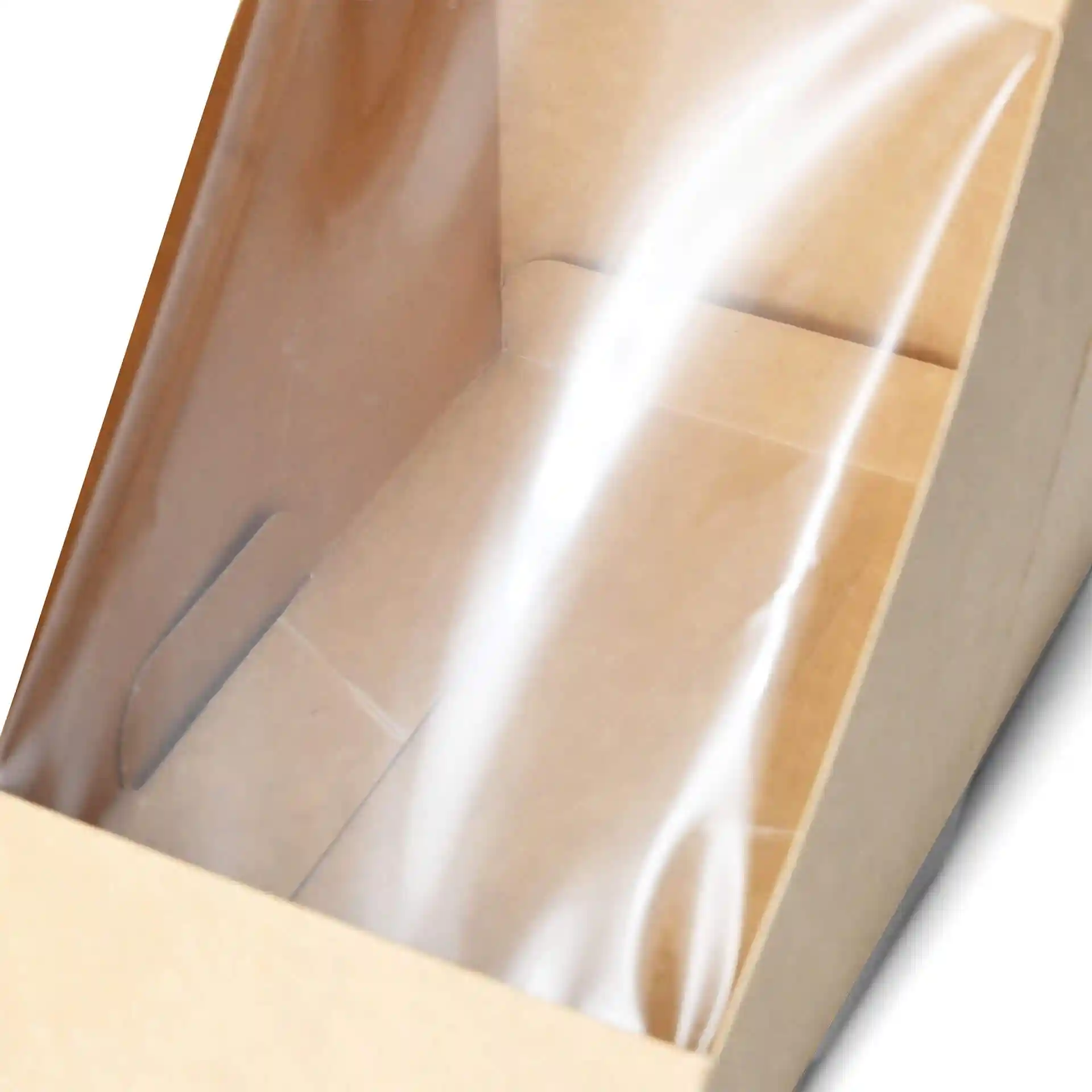 Triangular cardboard sandwich wedge box with a clear PLA window, showing the interior and brown material.