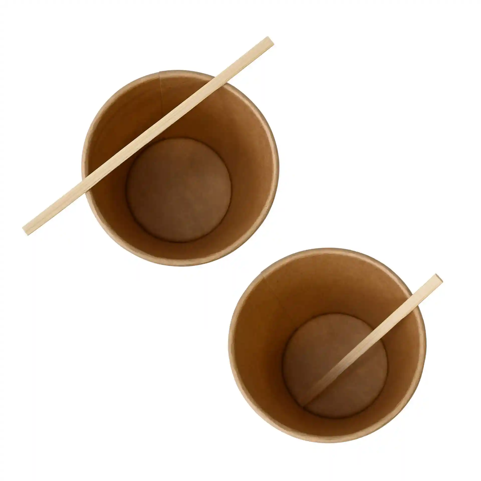 Two brown paper cups with a bamboo stirrer placed across the top of each cup.