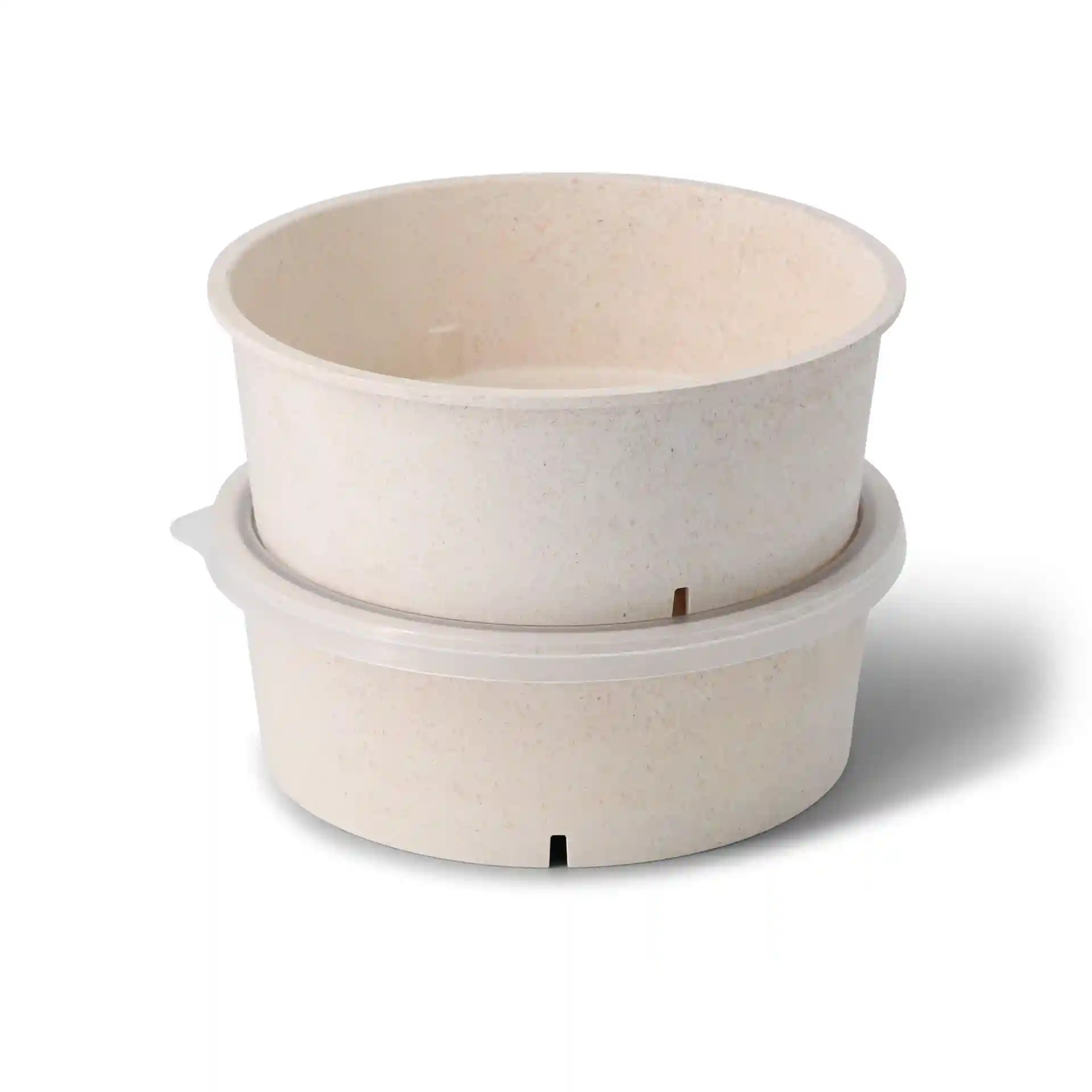 Round reusable bowls in cream white, made from bio compound, with a capacity of 1000 ml, stacked together.