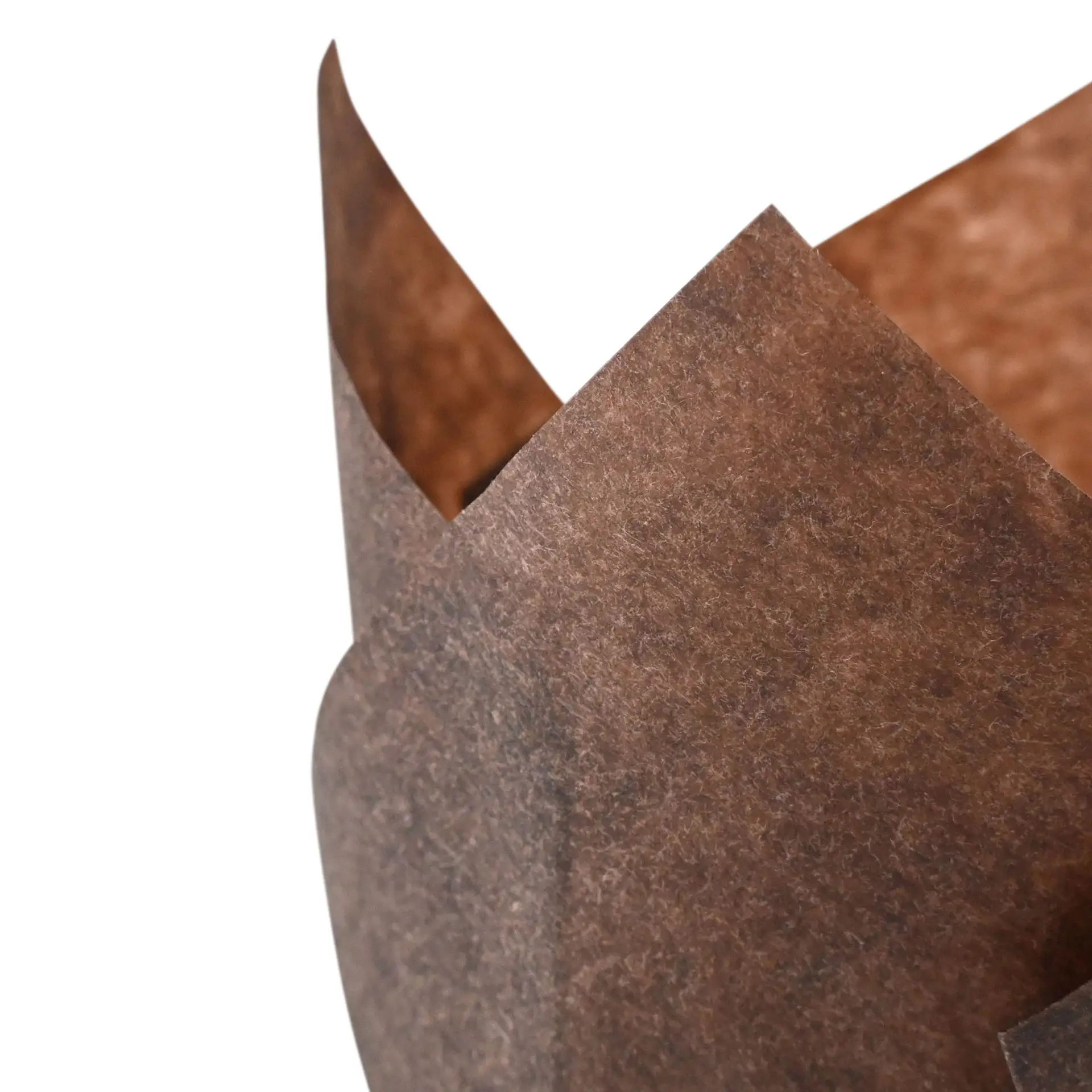 Brown paper muffin cup showing a crinkled edge, 5 cm diameter, designed for baking and packaging baked goods.