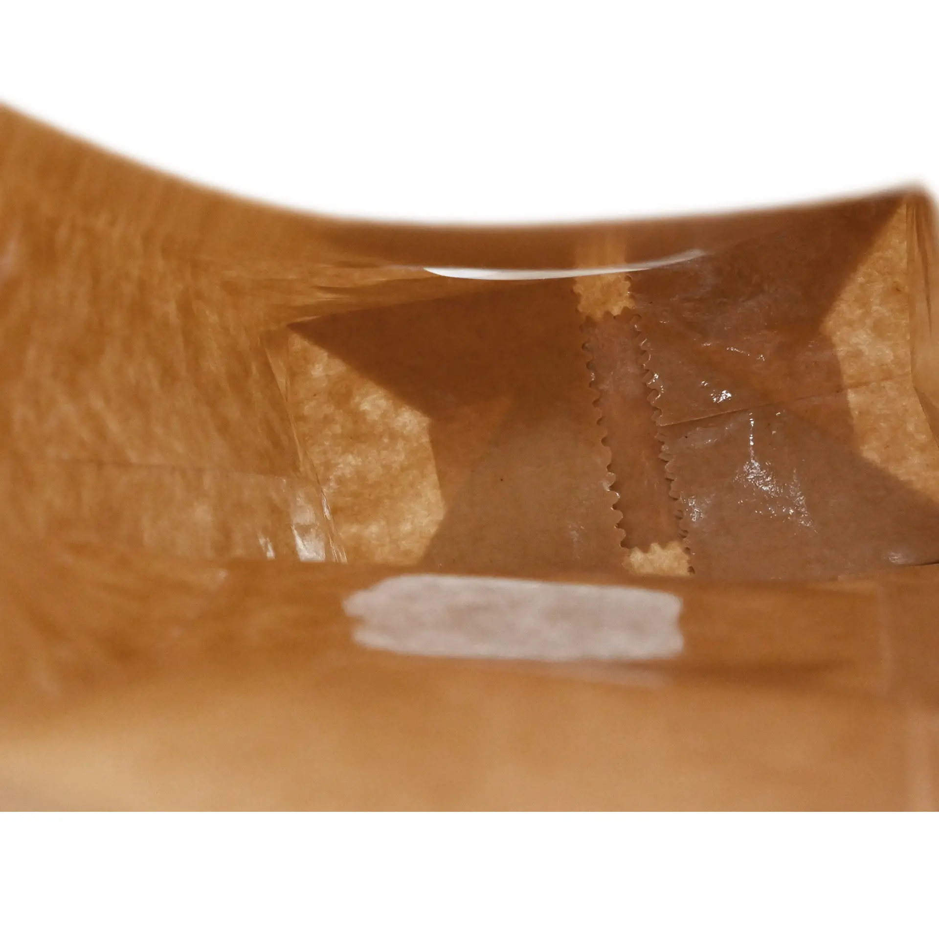 Interior view of a brown kraft paper block bottom bag with a window and tin tie, measuring 8.5 x 5 x 24 cm.