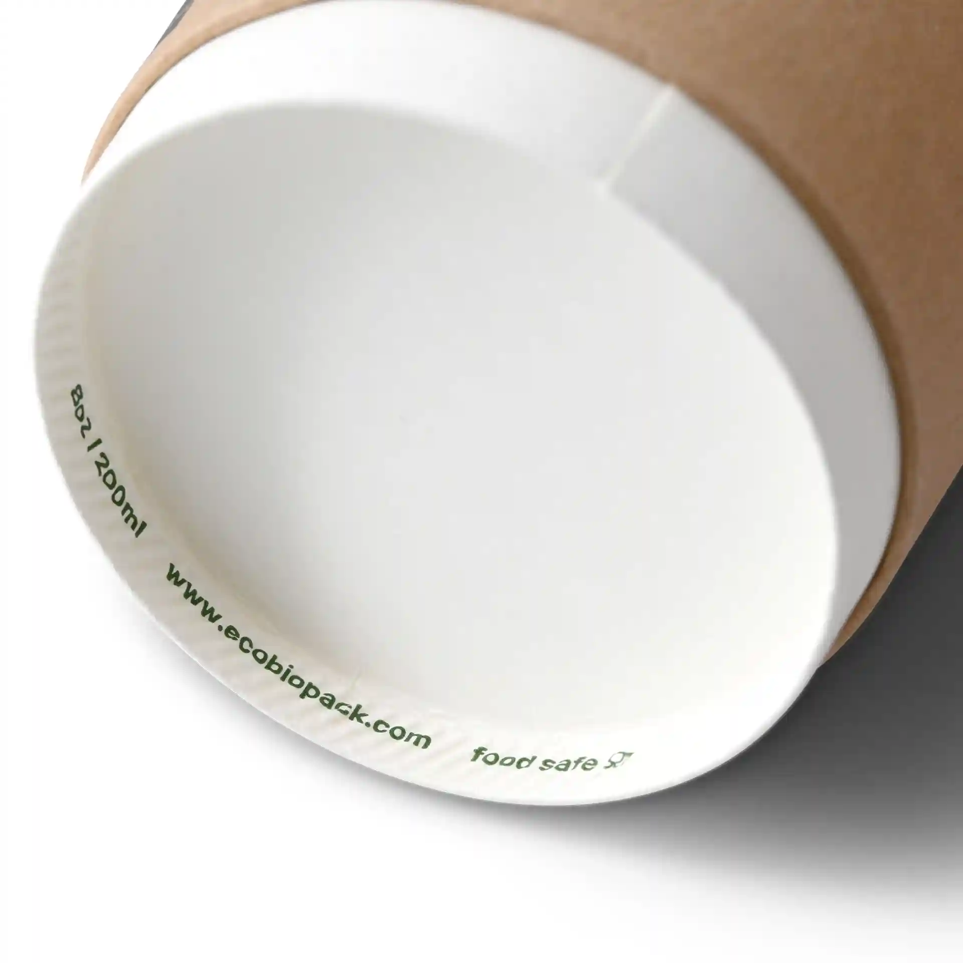 Brown coffee to go cup with a white interior, double wall design, and a diameter of 80 mm.