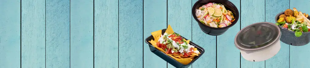 Cartoonfigur mit grünem, lächelndem Gesicht in einer beigen Takeout-Schale; drei Gerichte daneben auf einem blauen Holzhintergrund.