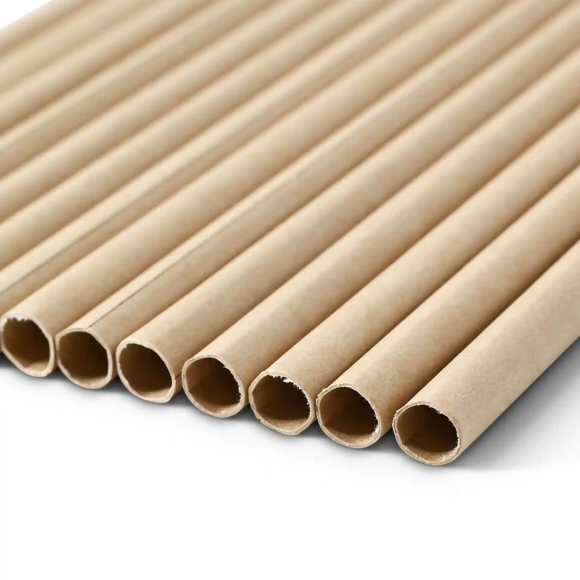 Brown paper jumbo drinking straws, 23 cm long and 0.8 cm wide, arranged in a row on a plain background.