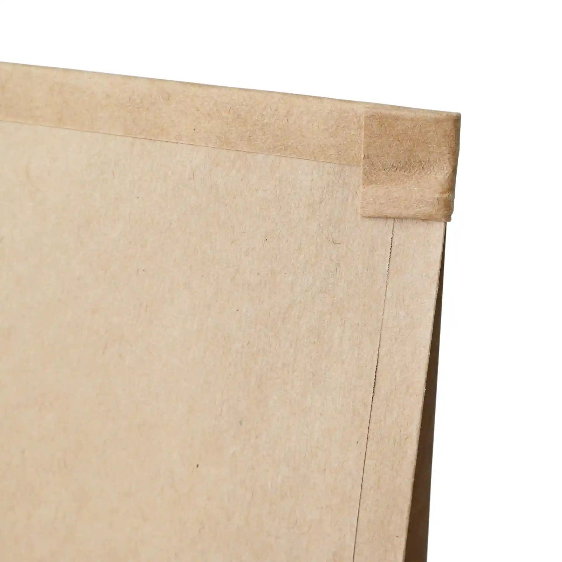 Close-up of a brown kraft paper bag with a tin tie and a viewing window, showing the top edge and corner.