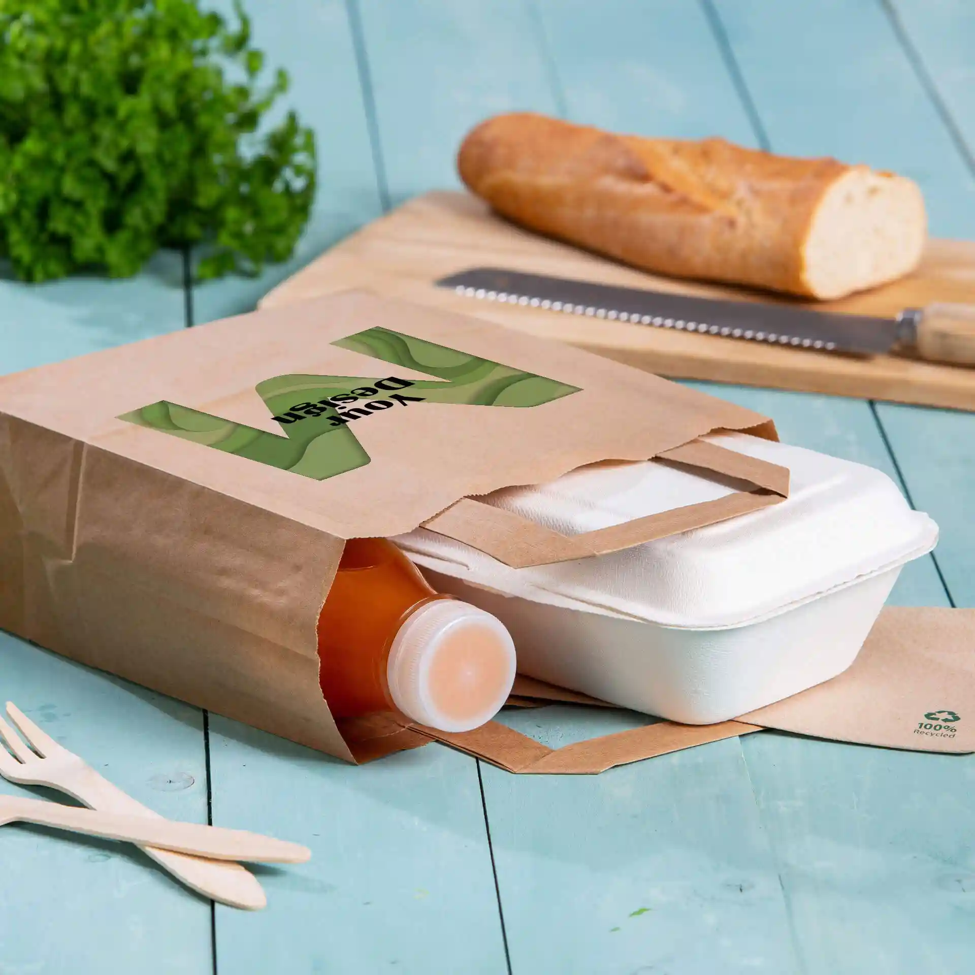 Brown paper carrier bag with a rectangular shape, containing a bottle and a food container, on a blue wooden surface.