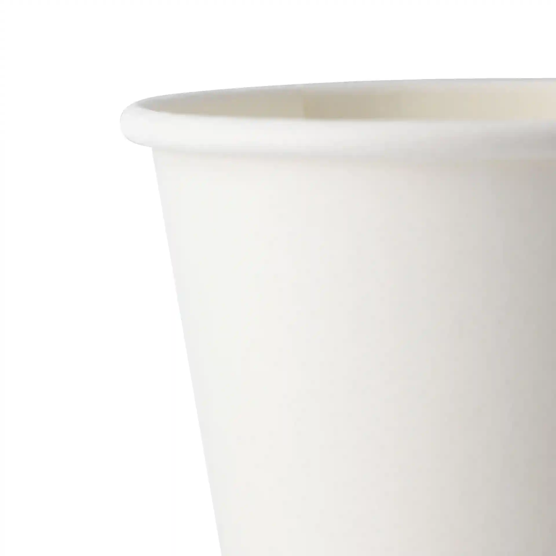 White paper cup with a tapered design and a smooth rim, partially visible against a white background.