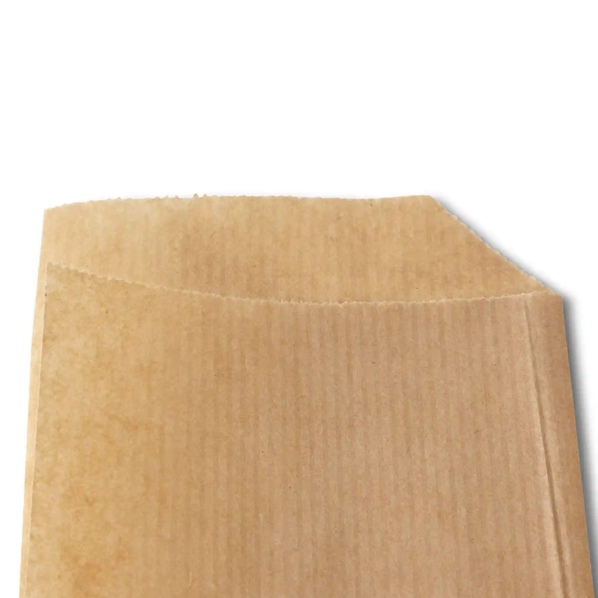 Close-up of the top edge of brown food wrapping paper, showing a smooth finish and a slight curve.
