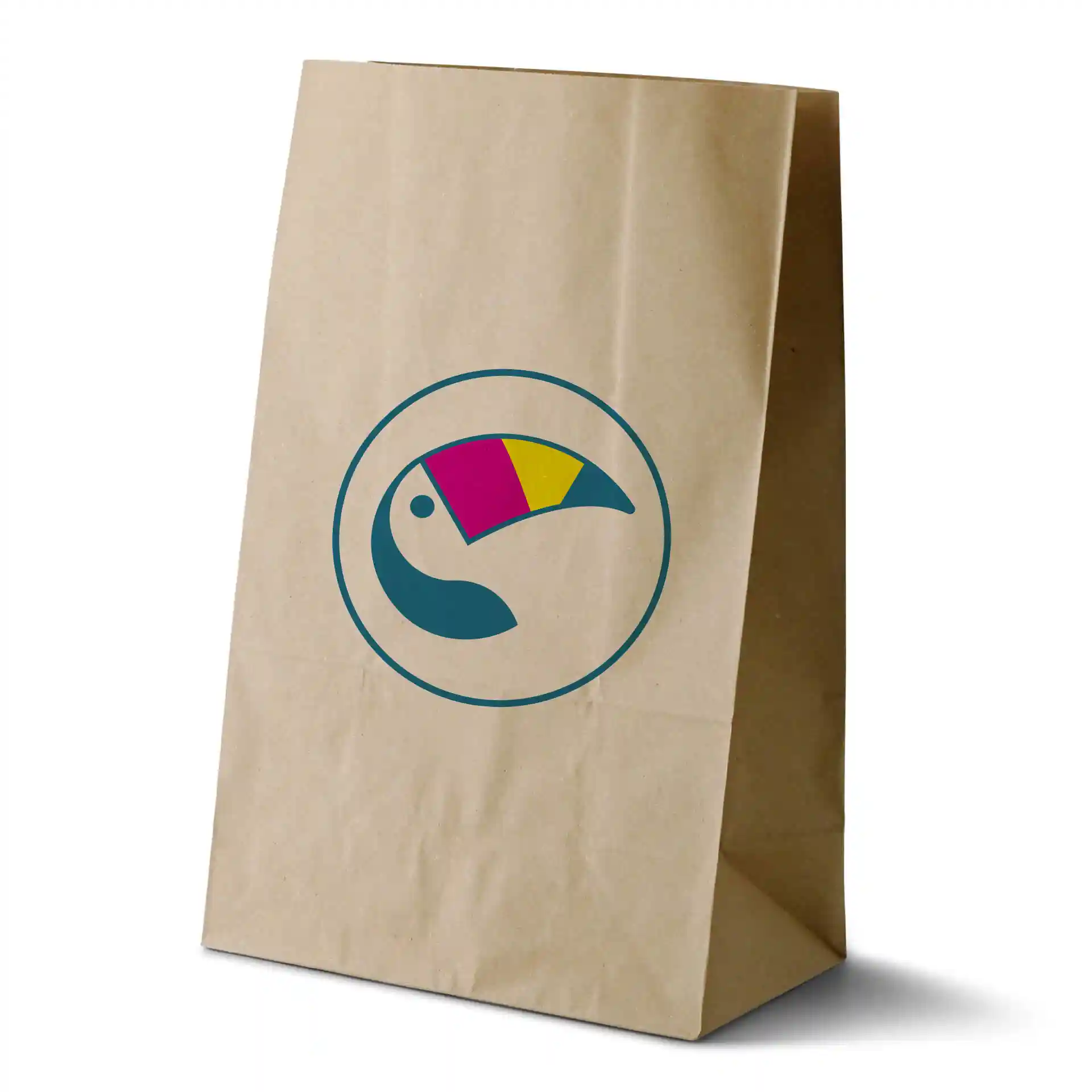 Brown paper bag with a circular toucan logo featuring pink, yellow, and blue colors. Dimensions are 26 x 14 x 40 cm.