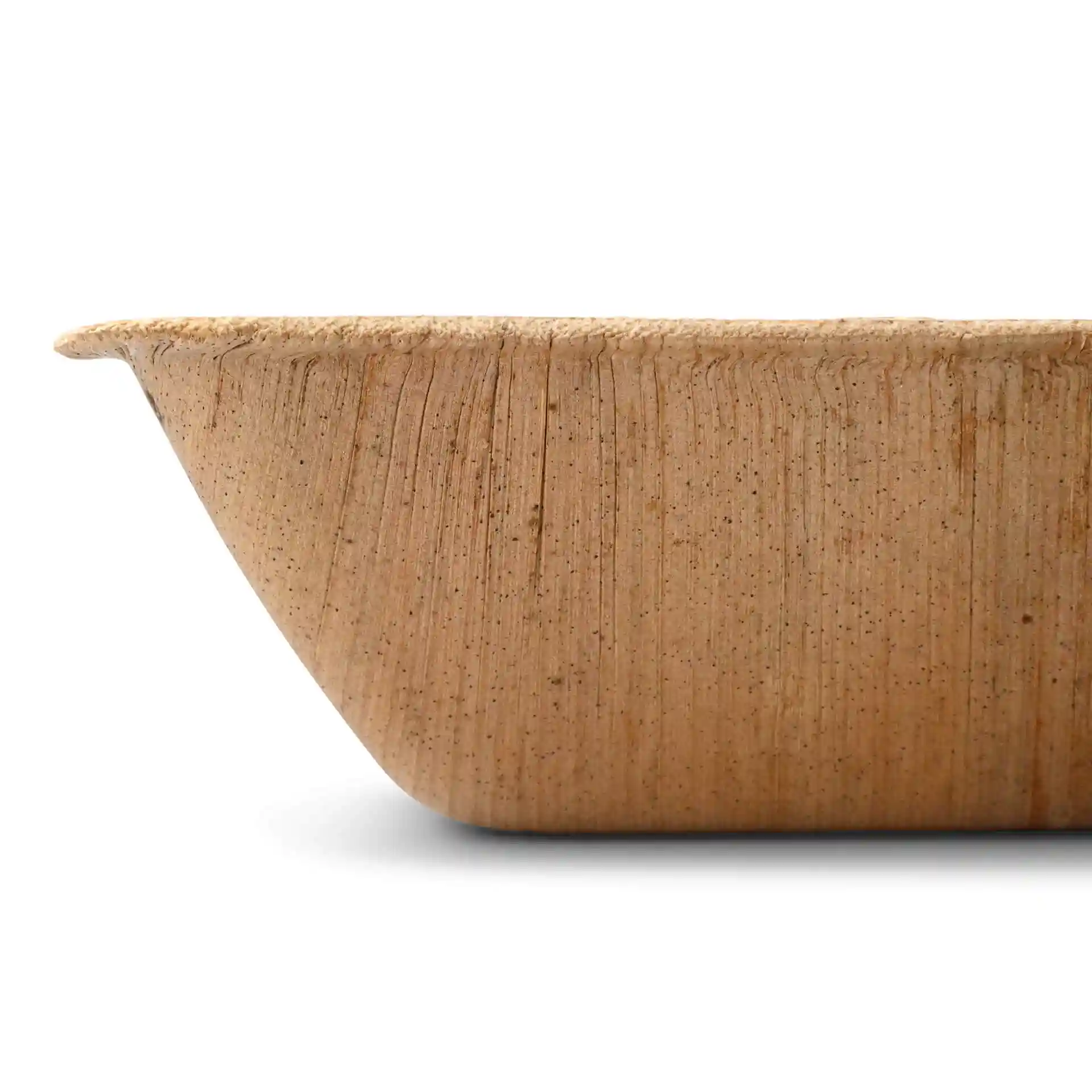 Square palm leaf bowl with a grain texture, showing the edge and side profile.