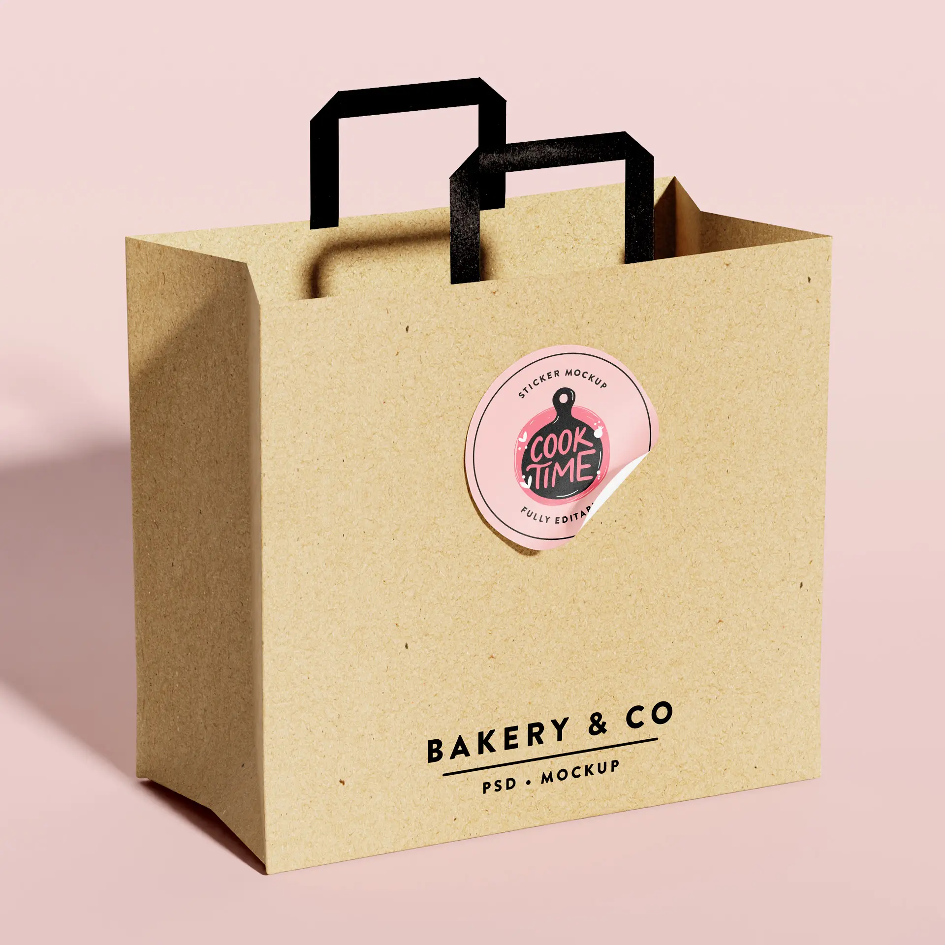 Brown kraft paper bag with black handles and a circular label featuring a design. Brand name visible at the bottom.